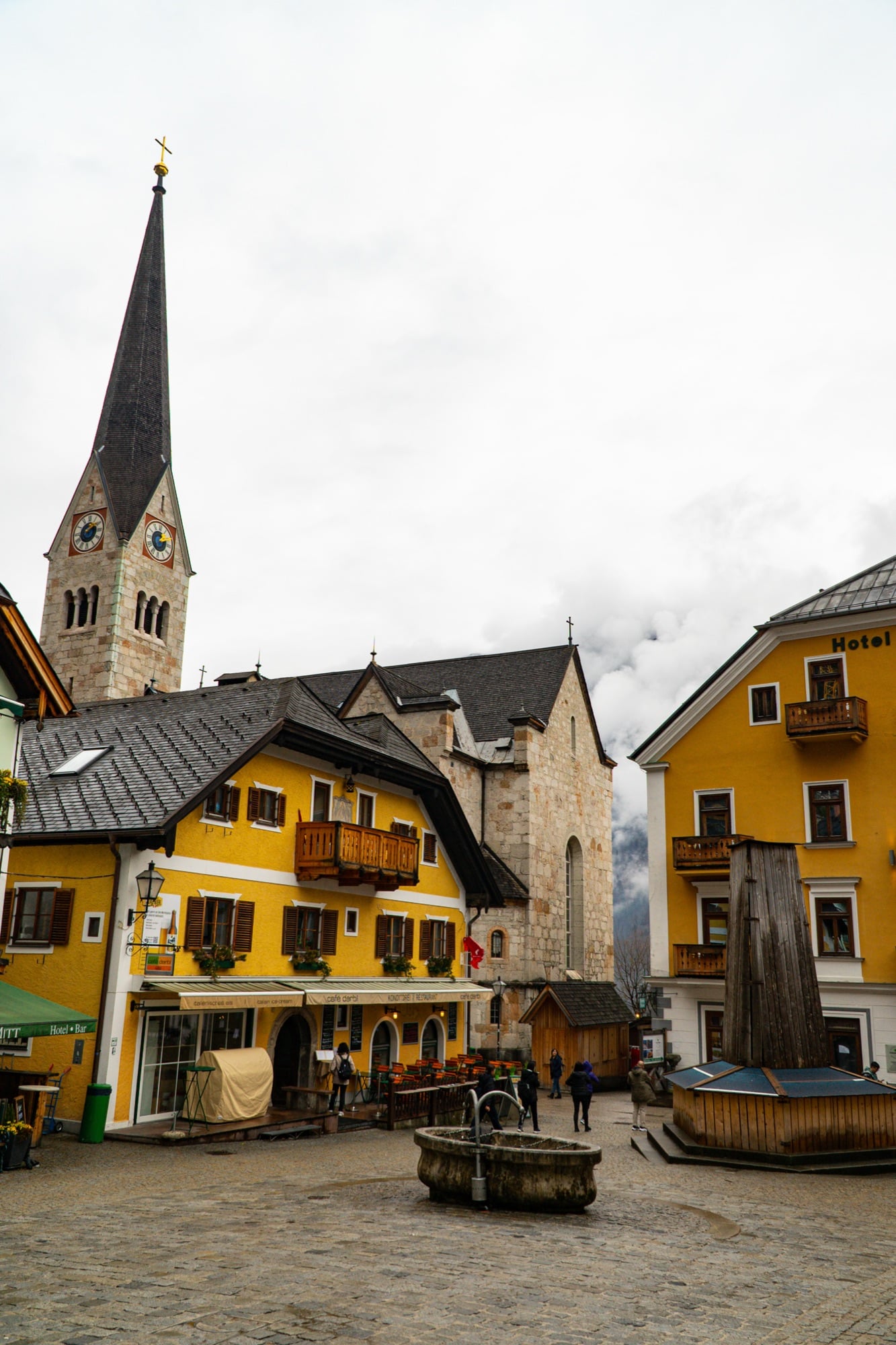The market square with its fountain below the church tower, Hallstatt