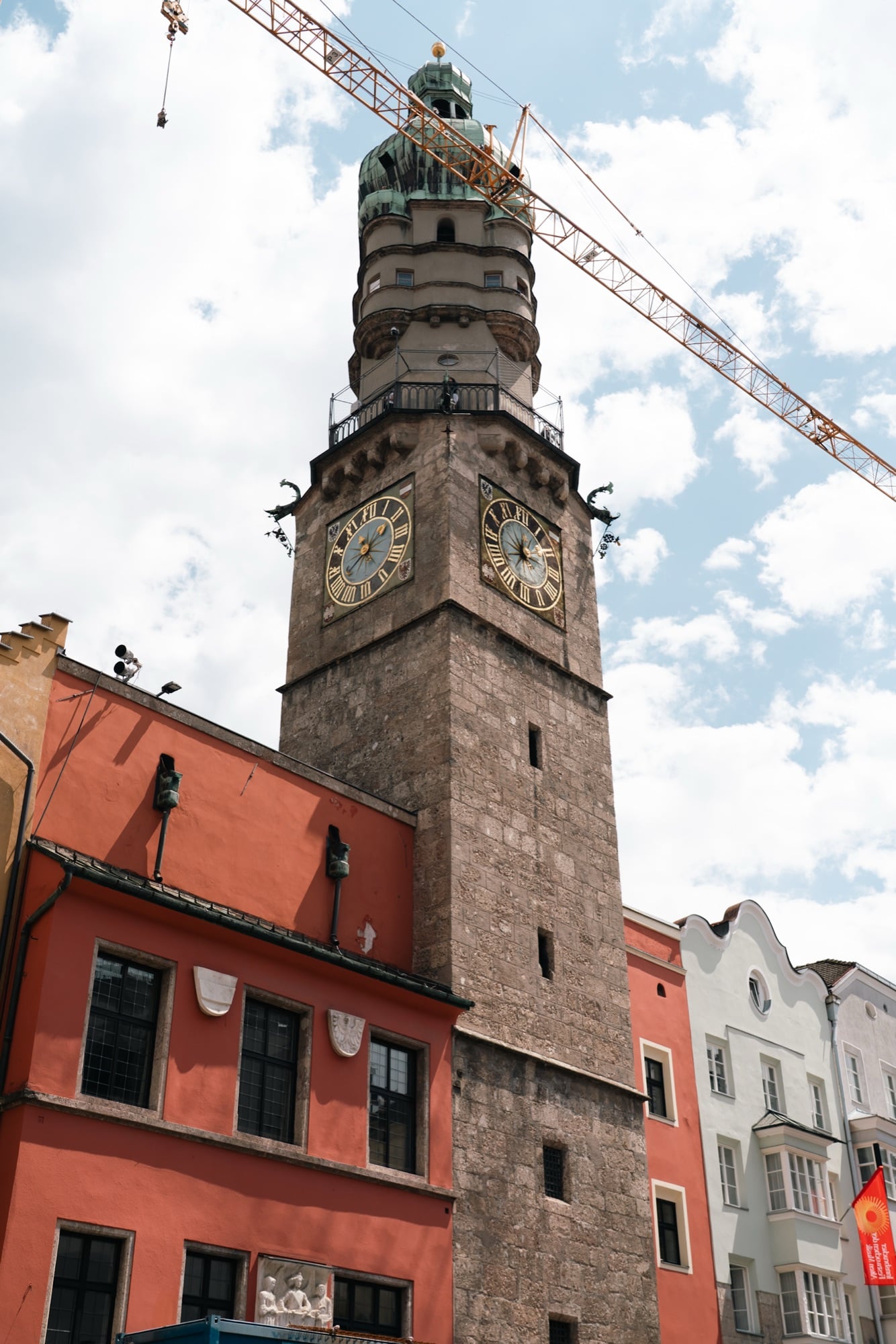 The red-and-white Stadtturm city tower rising over the old town, Innsbruck