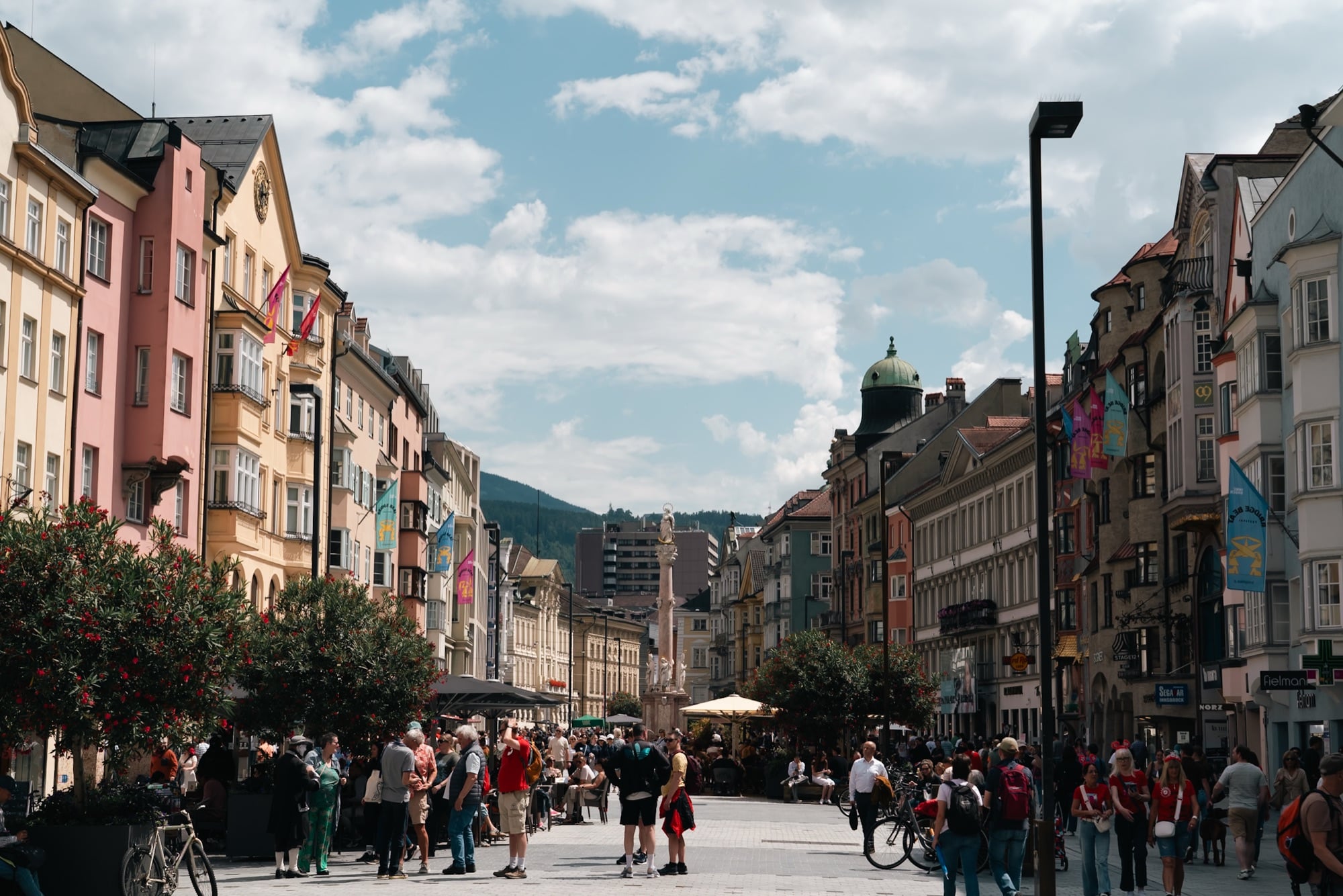 The colourful buildings of Maria-Theresien-Strasse under a bright sky, Innsbruck