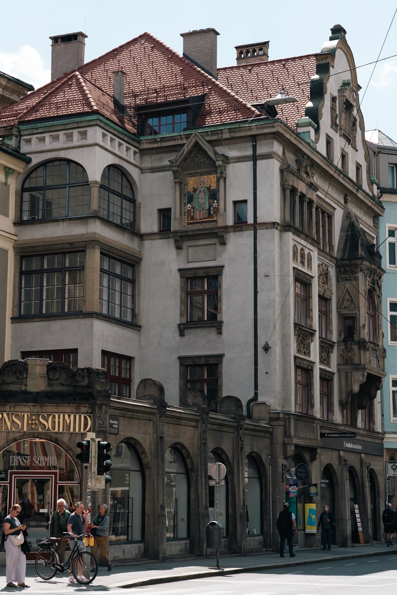 An ornate carved facade above the street, Innsbruck