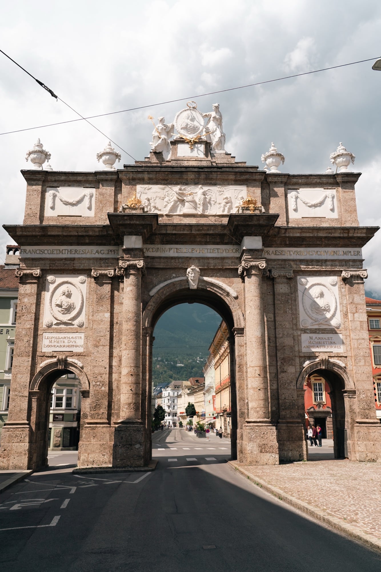 The Triumphpforte arch with the mountains rising beyond, Innsbruck