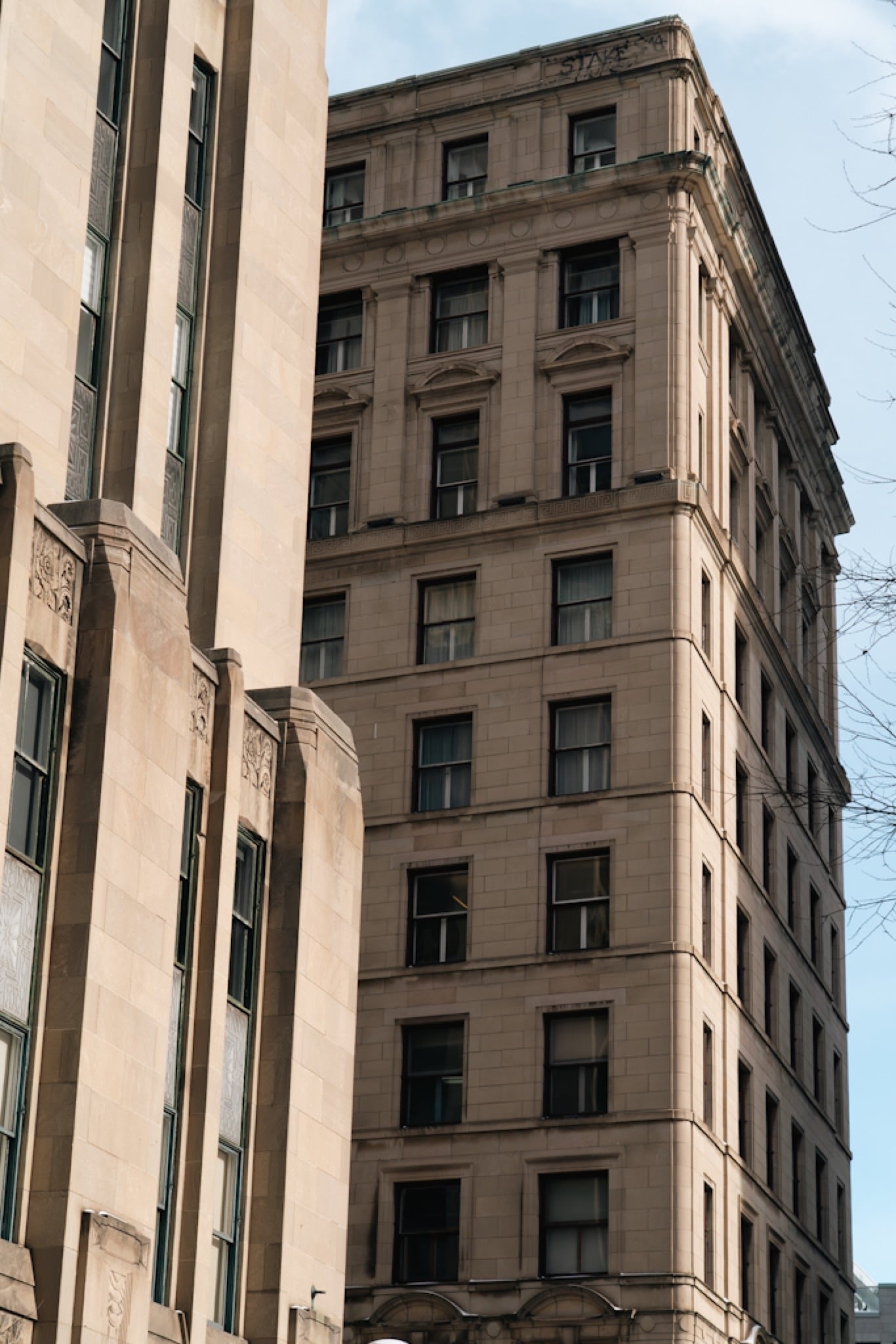 The Art-Deco Aldred Building rising over Old Montreal