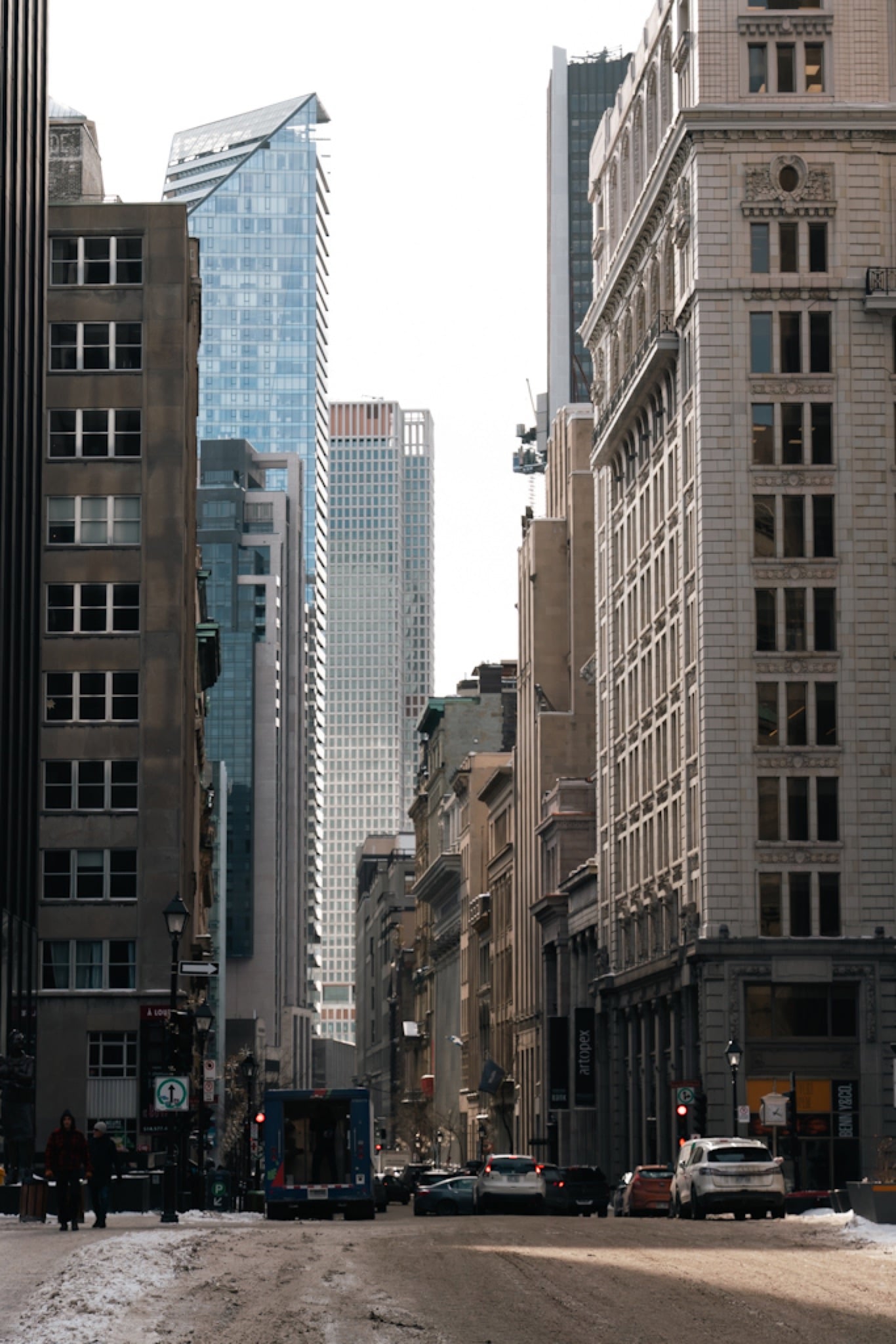 Modern towers above a snowy downtown street