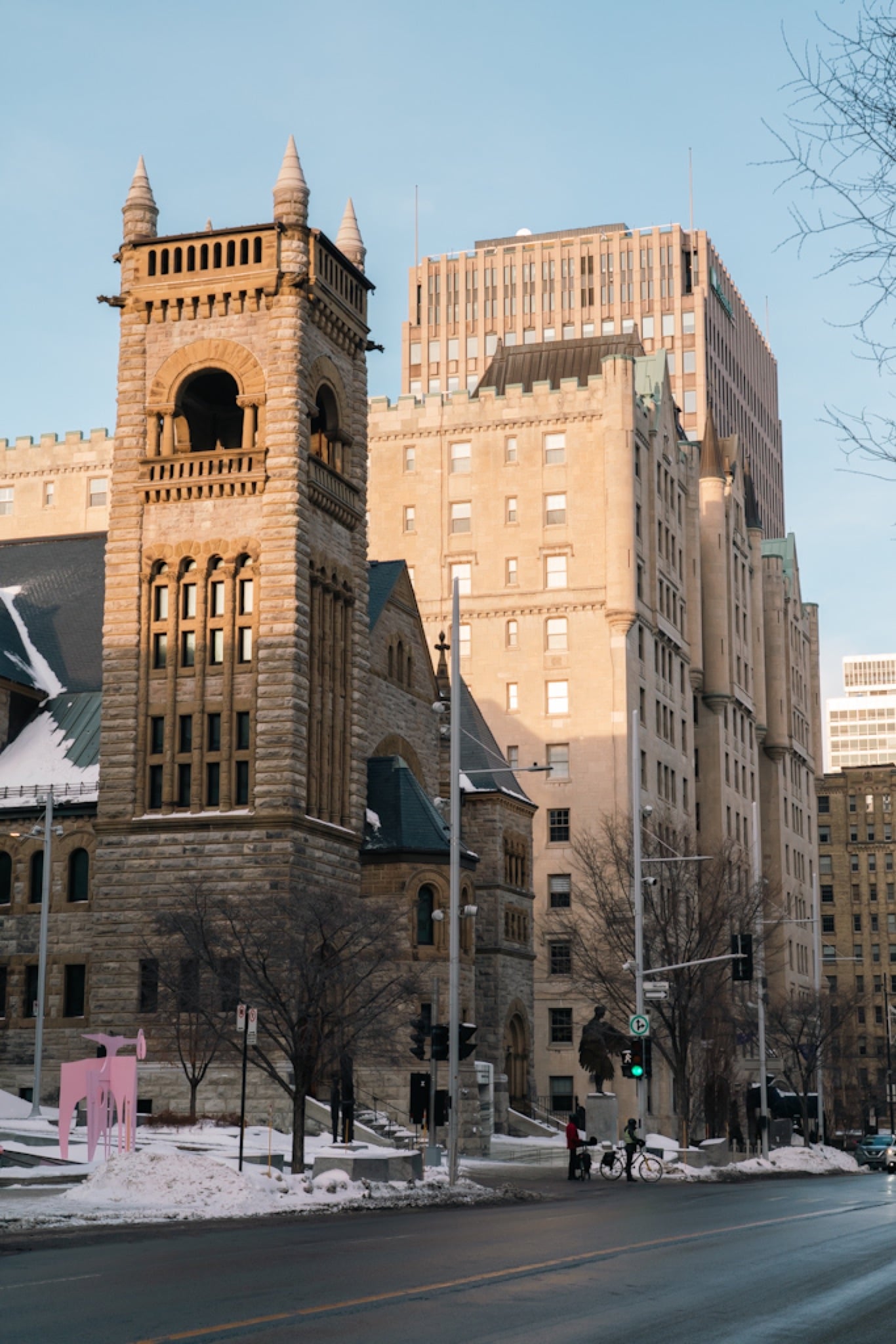 A brick clock tower rising over Old Montreal