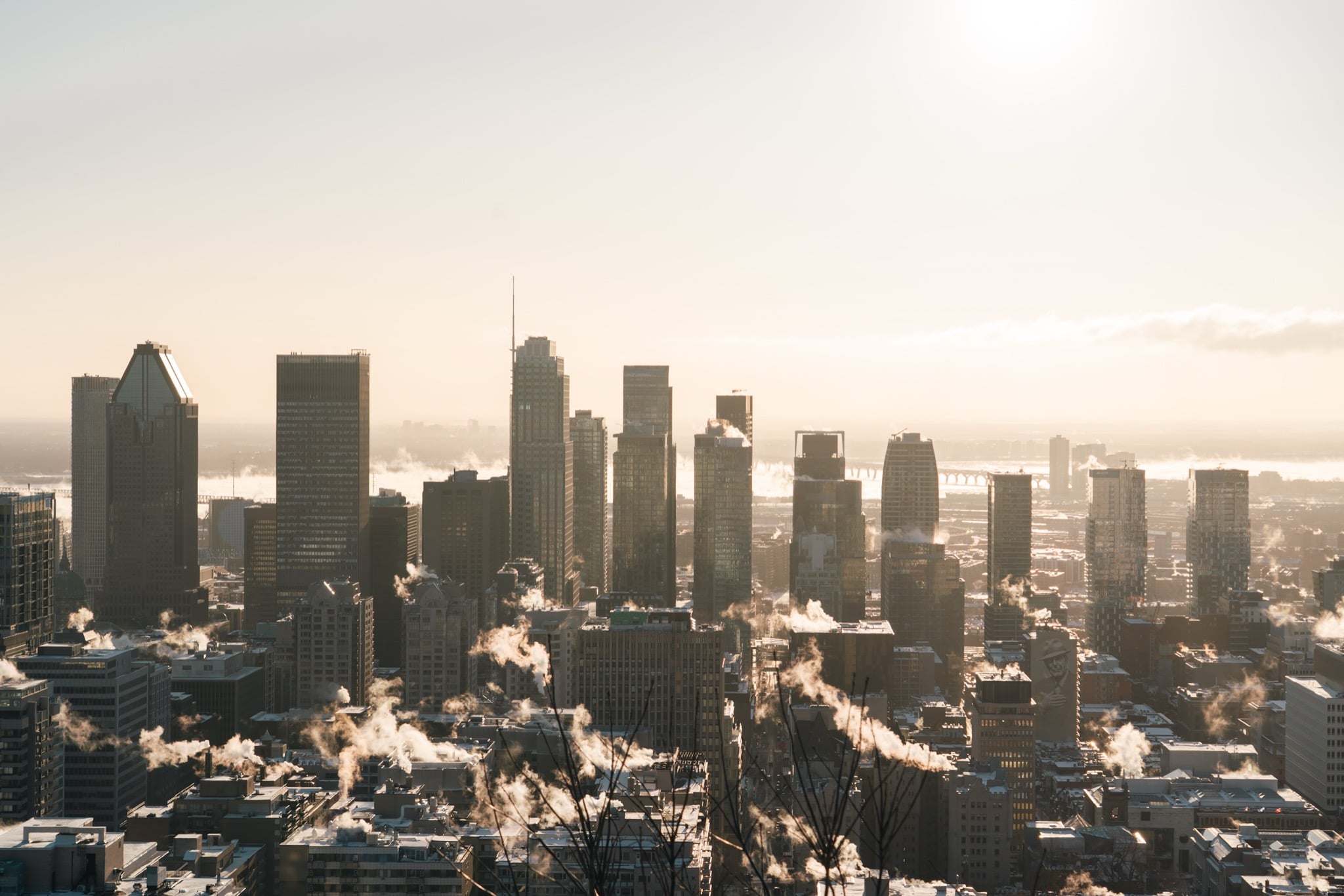 The downtown Montreal skyline under a golden winter haze