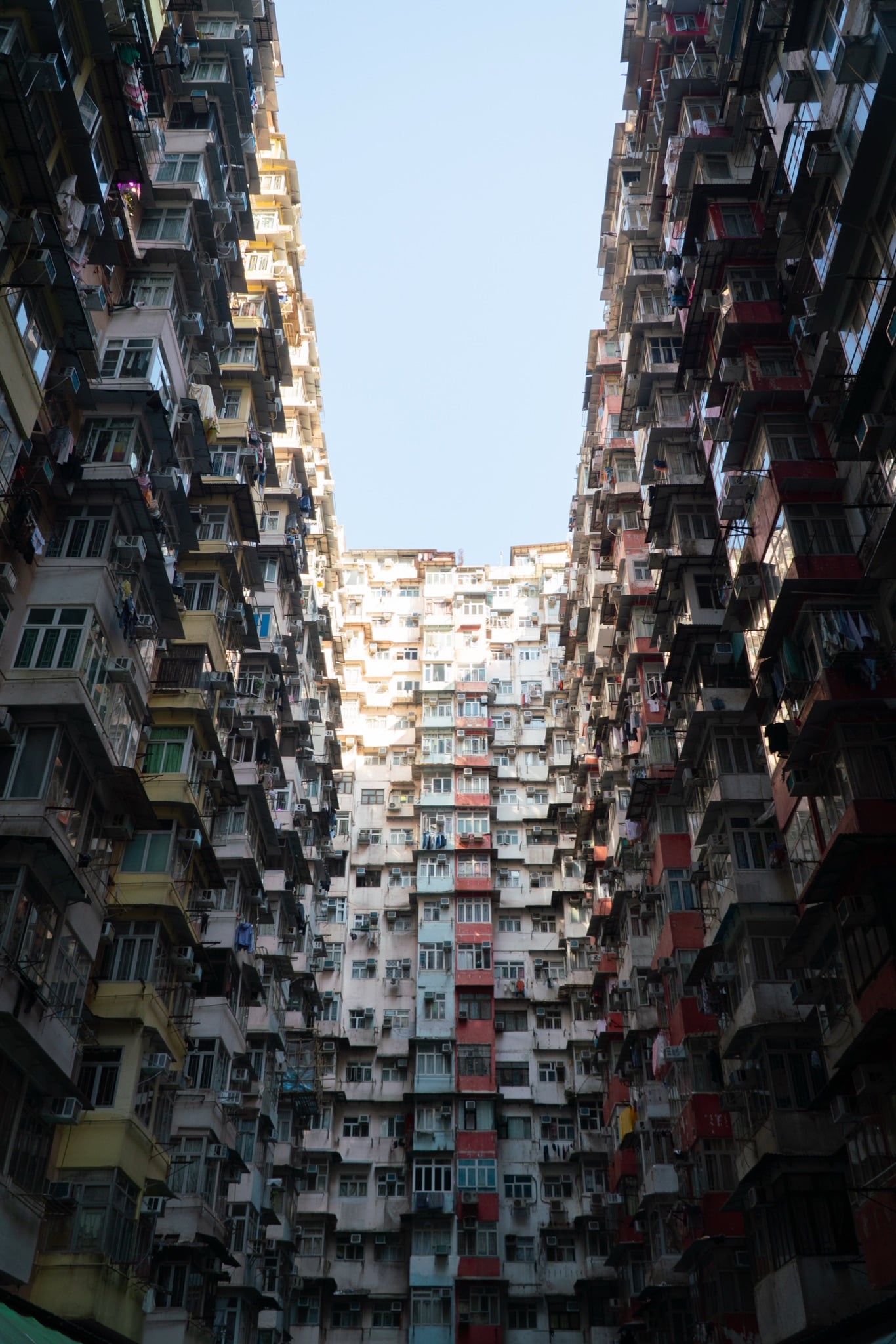 Laundry and balconies climbing a Quarry Bay tower, Hong Kong