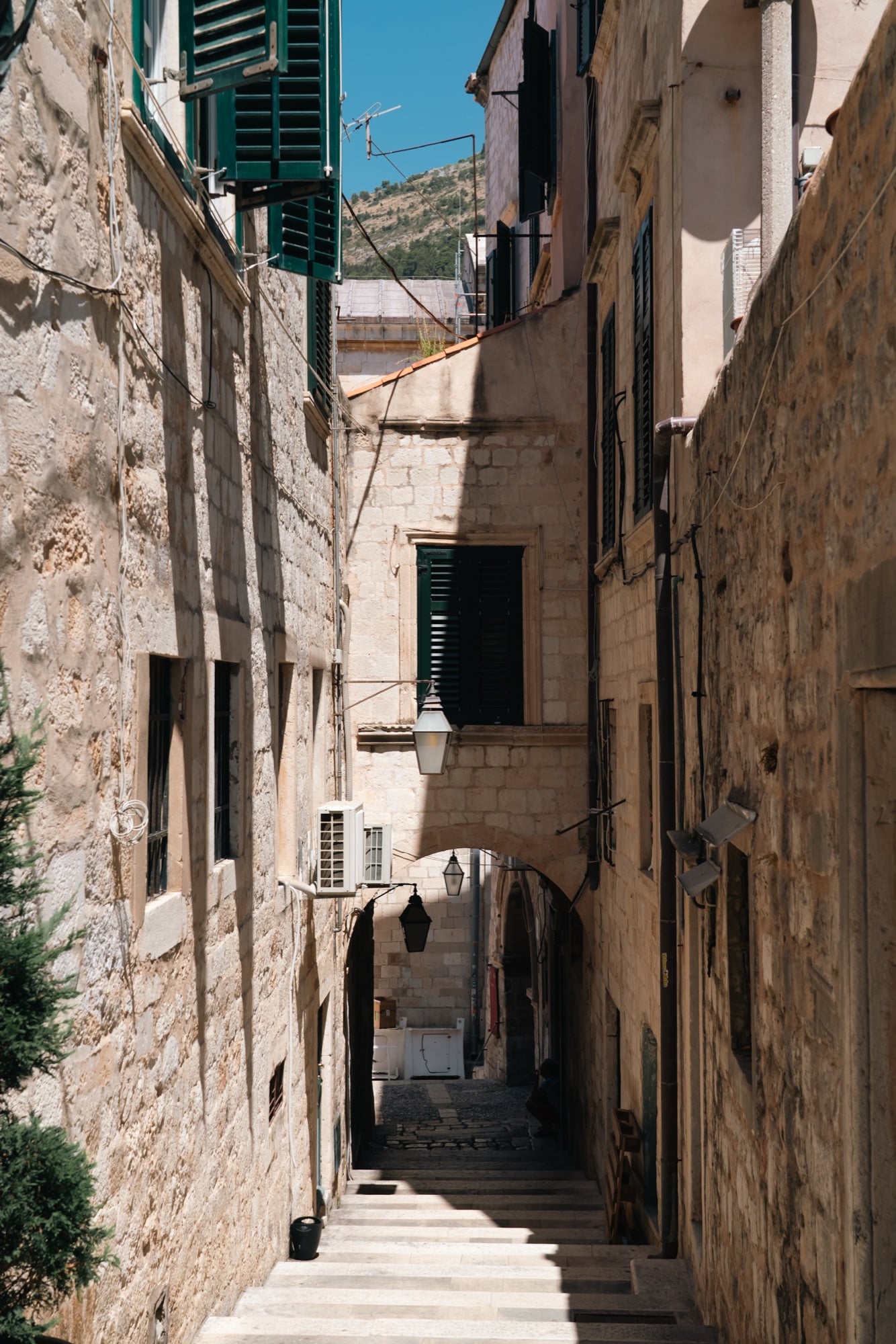 A quiet stone stairway climbing between the Old Town houses, Dubrovnik