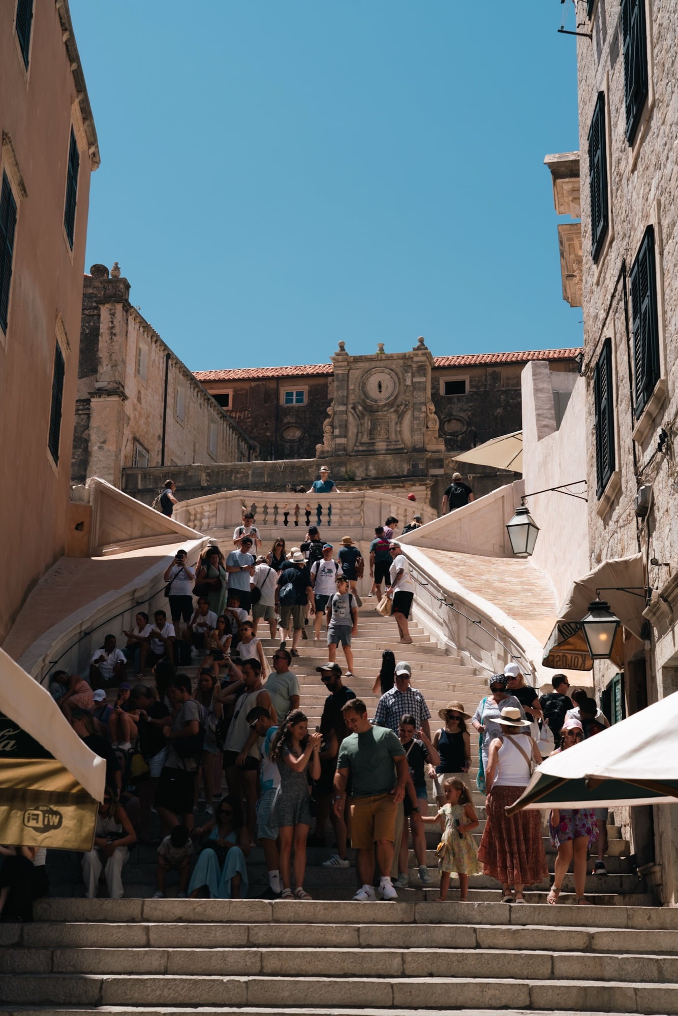 Crowds climbing the Jesuit Staircase, the Cathedral dome rising beyond, Dubrovnik