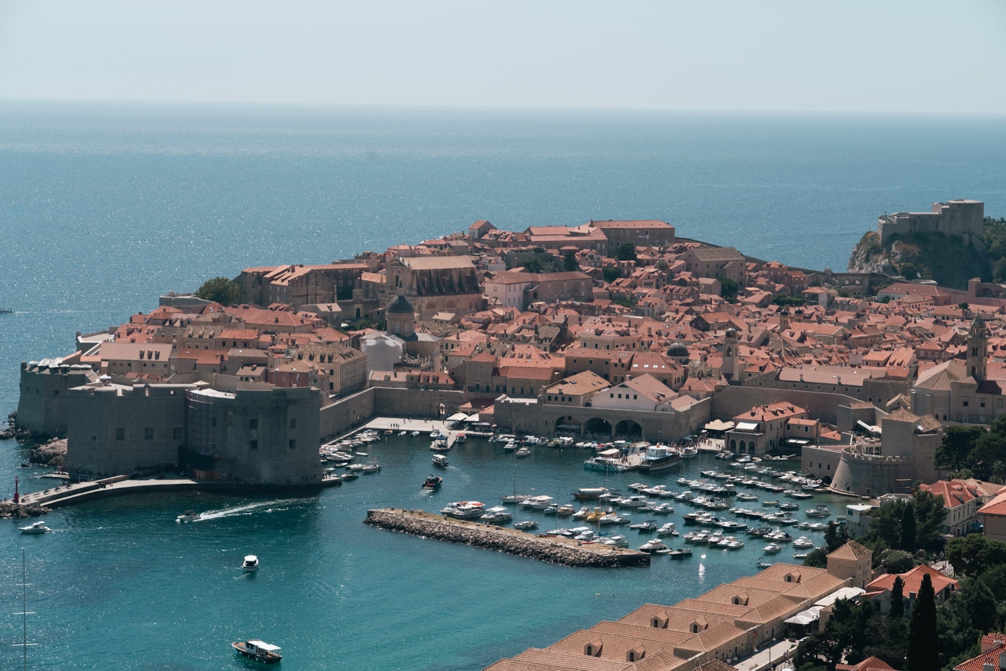 An elevated view over the Old Town and the fortified Old Port jutting into the sea, Dubrovnik
