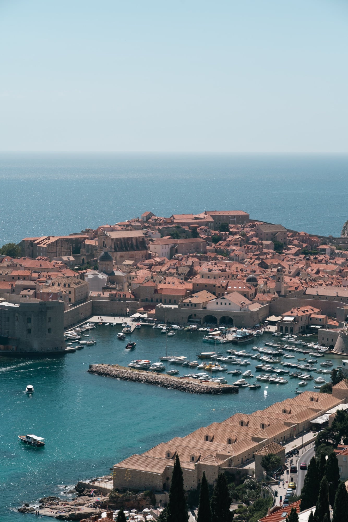 The terracotta rooftops and old harbour of Dubrovnik's walled Old Town above the Adriatic