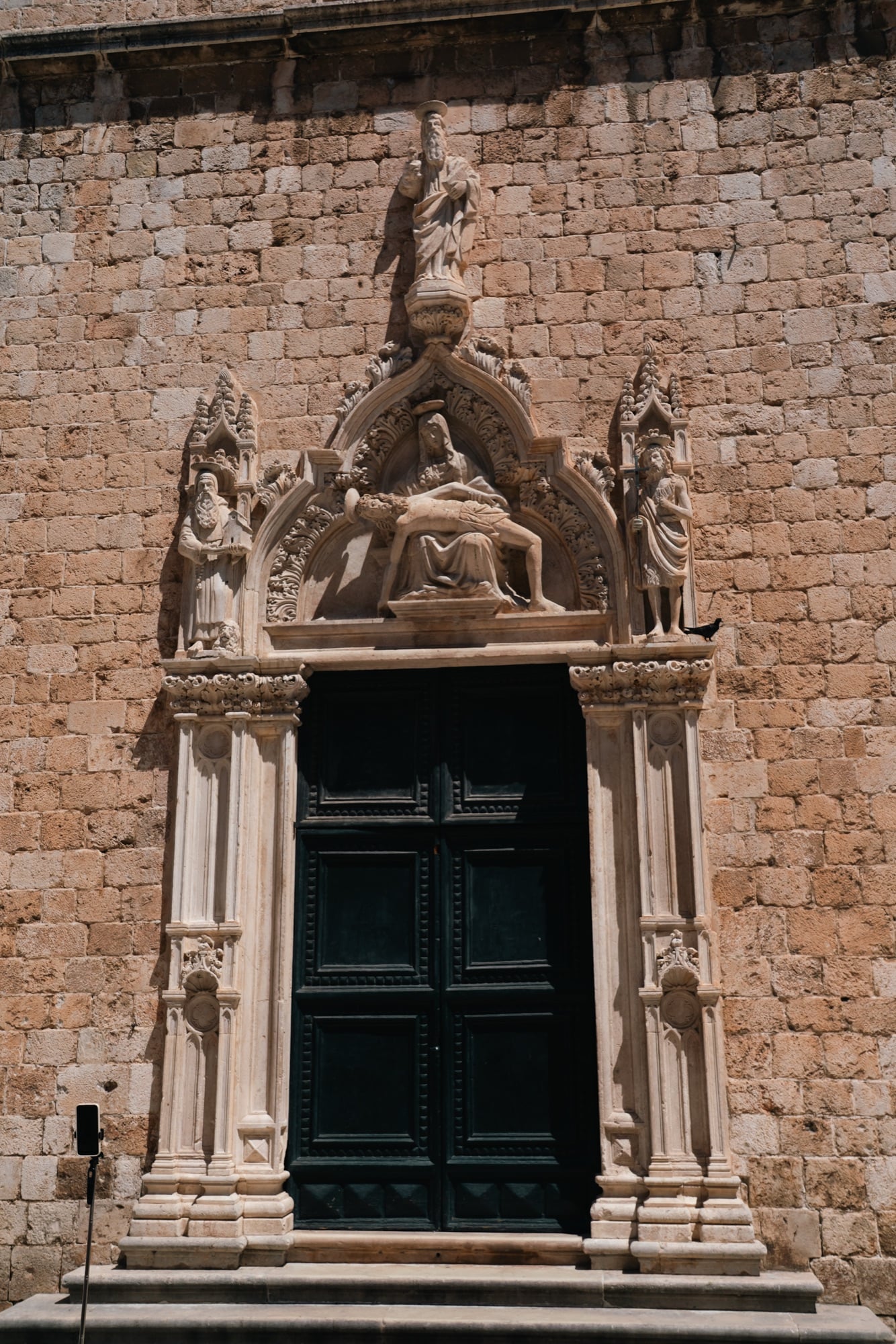 An ornately carved stone portal in the Old Town, Dubrovnik