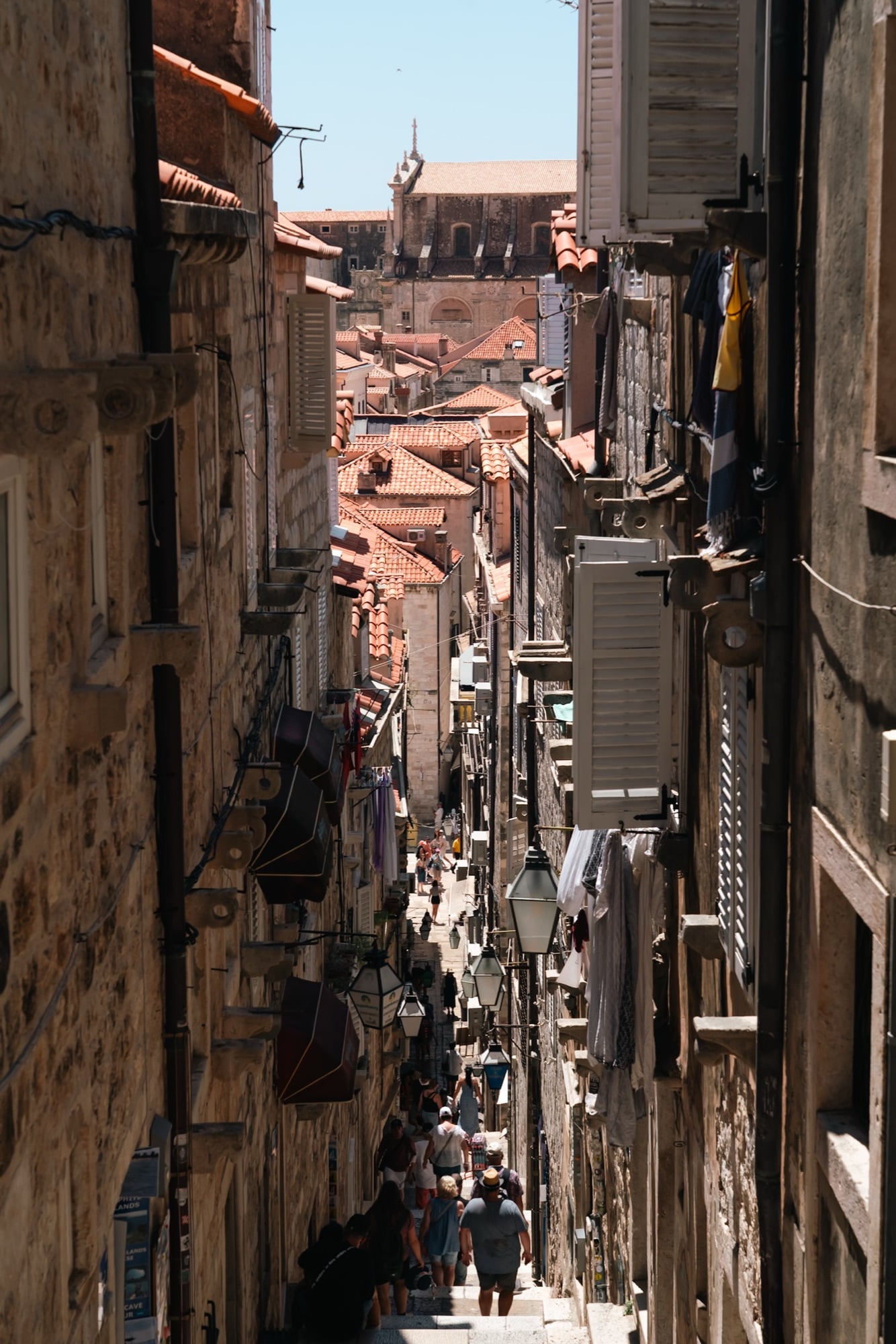 A steep stepped alley between tall stone houses in the Old Town, Dubrovnik
