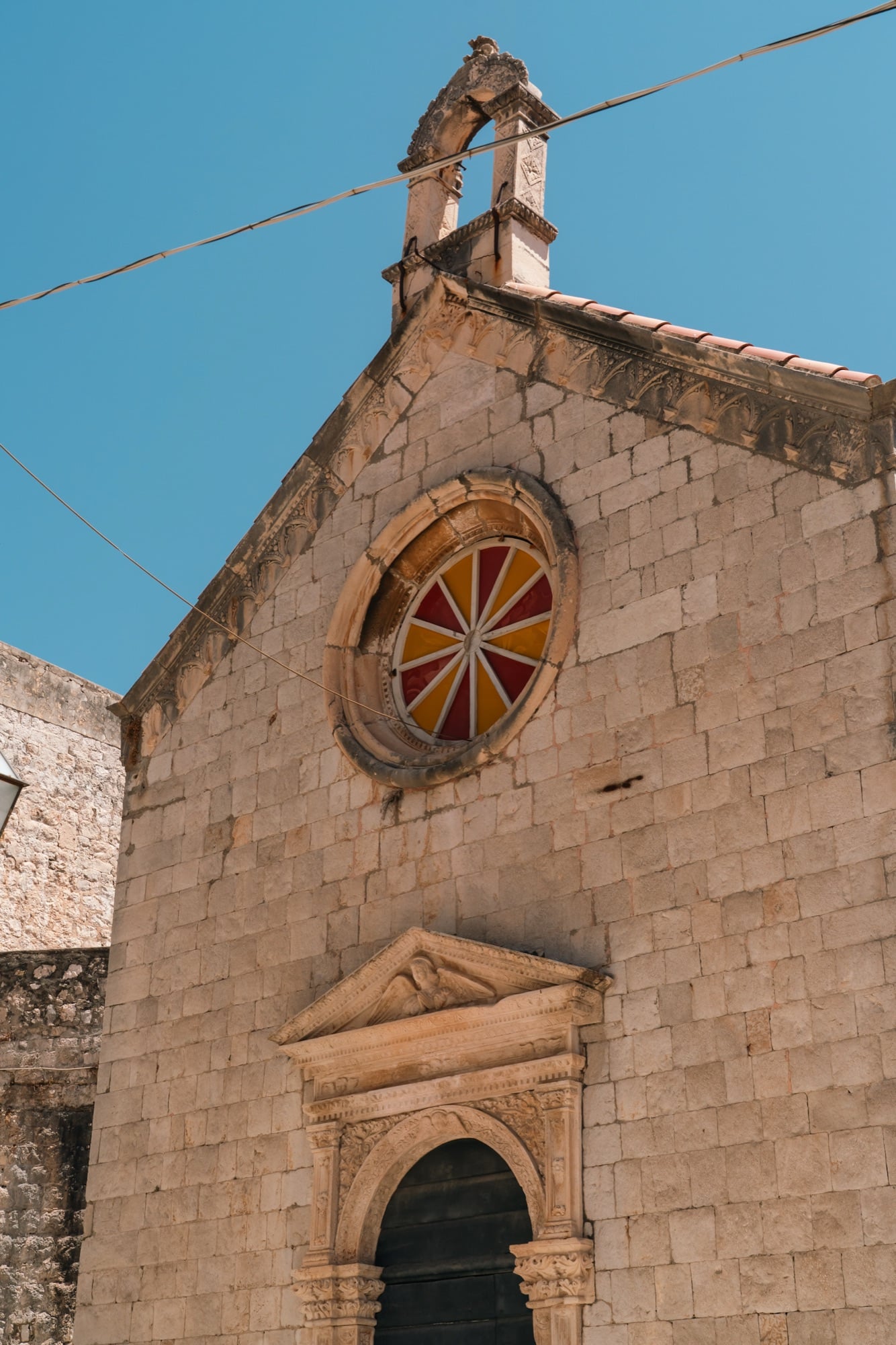The rose window and gabled facade of the Church of St. Saviour, Dubrovnik
