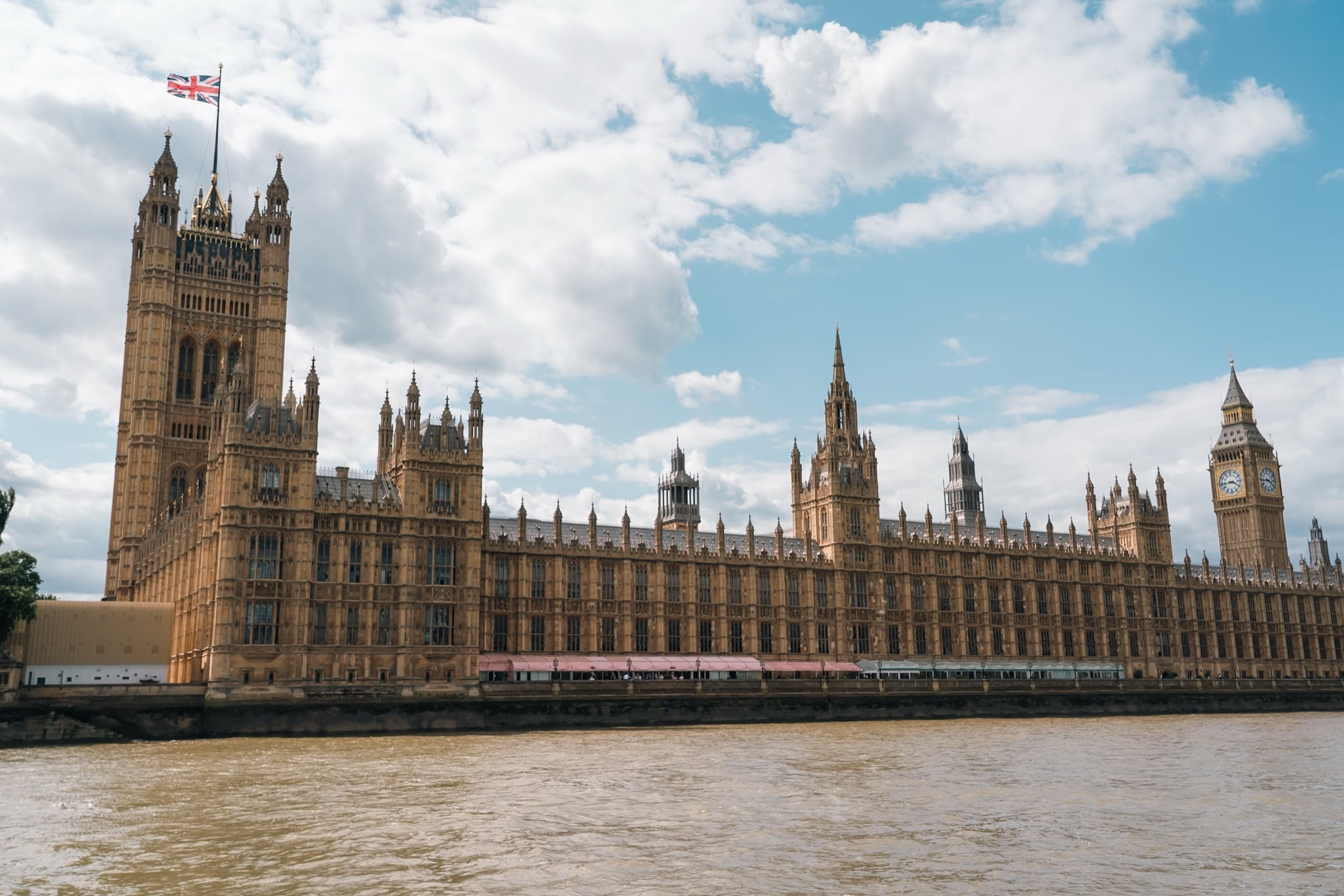 The full river frontage of the Palace of Westminster in sunlight, from Victoria Tower to Big Ben