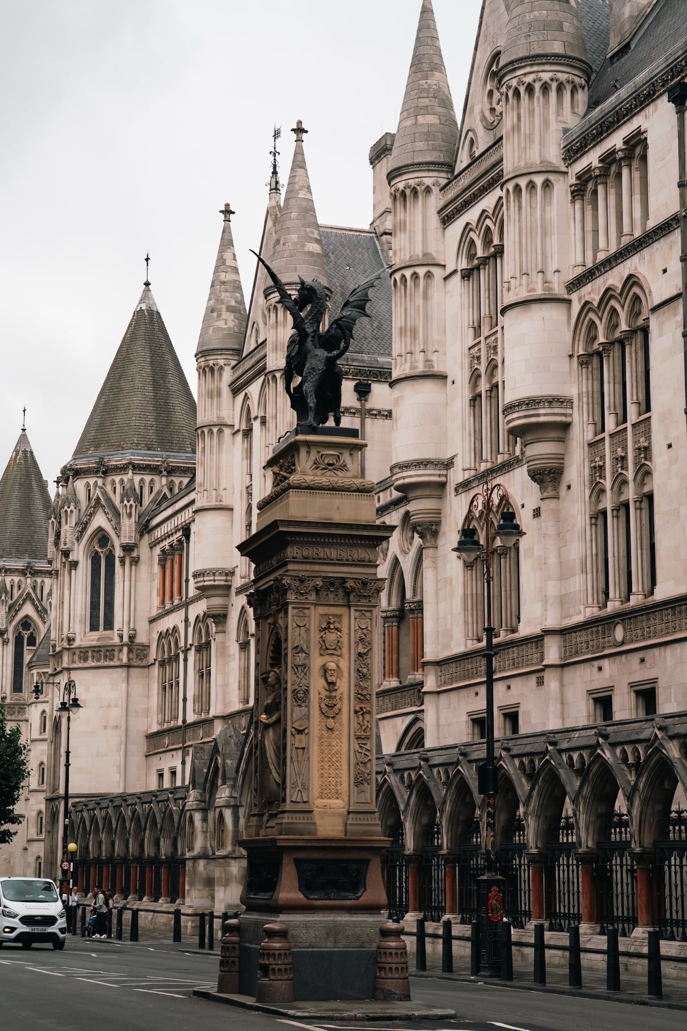 The Temple Bar Memorial dragon standing in the street beside the Royal Courts of Justice