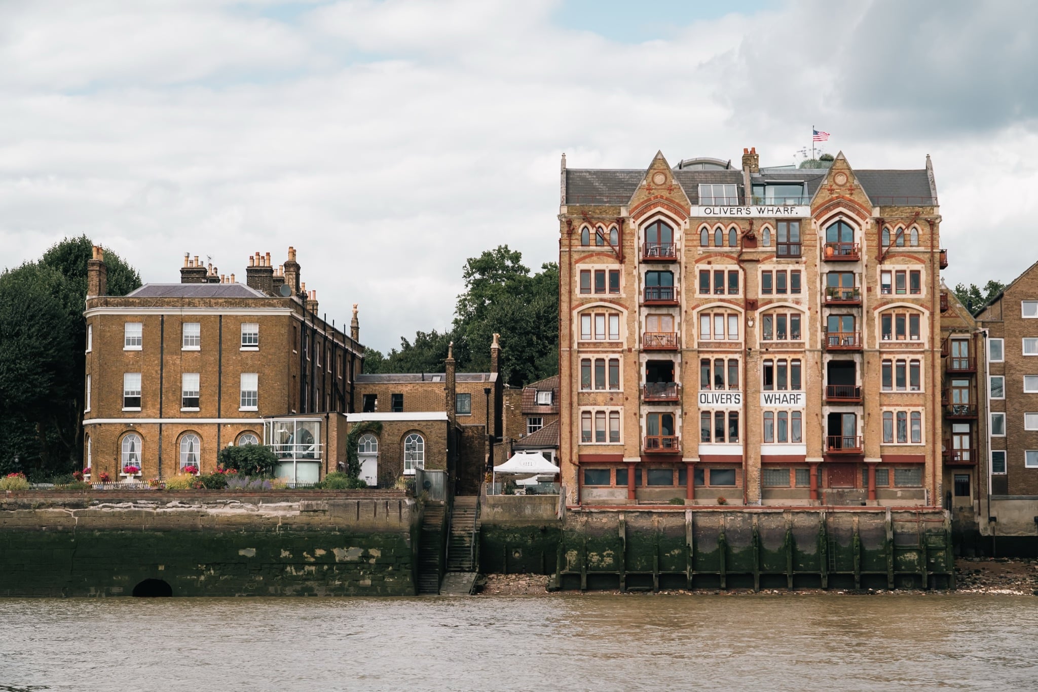The Gothic-fronted Oliver's Wharf warehouse conversion on the Thames at Wapping