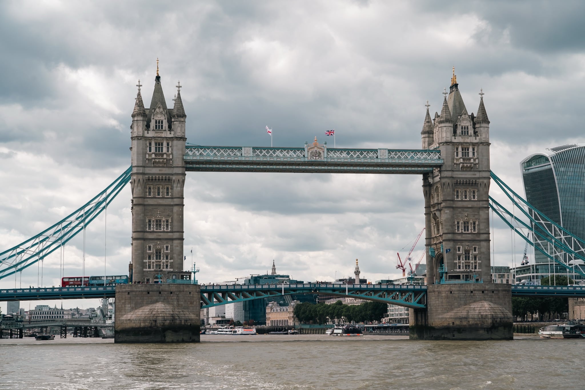 Tower Bridge spanning the Thames under a heavy grey sky