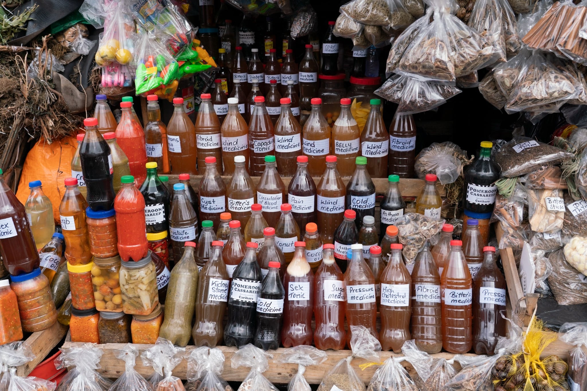 Bottled bush medicines and tonics for sale at a Georgetown market stall