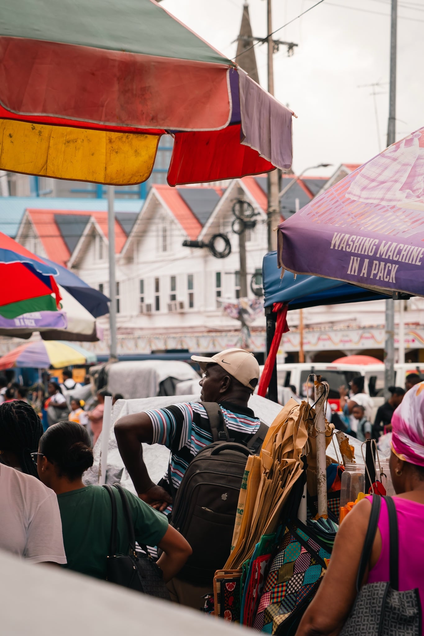 Shoppers crowding the awning-covered lanes of Stabroek Market