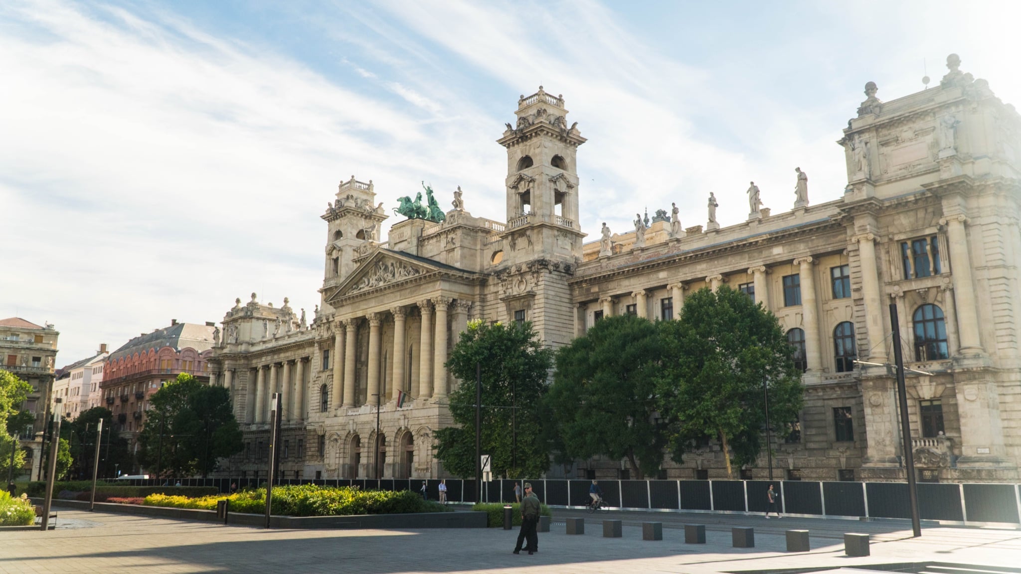 The columned facade and rooftop bronze quadriga of the former Curia on Kossuth Square