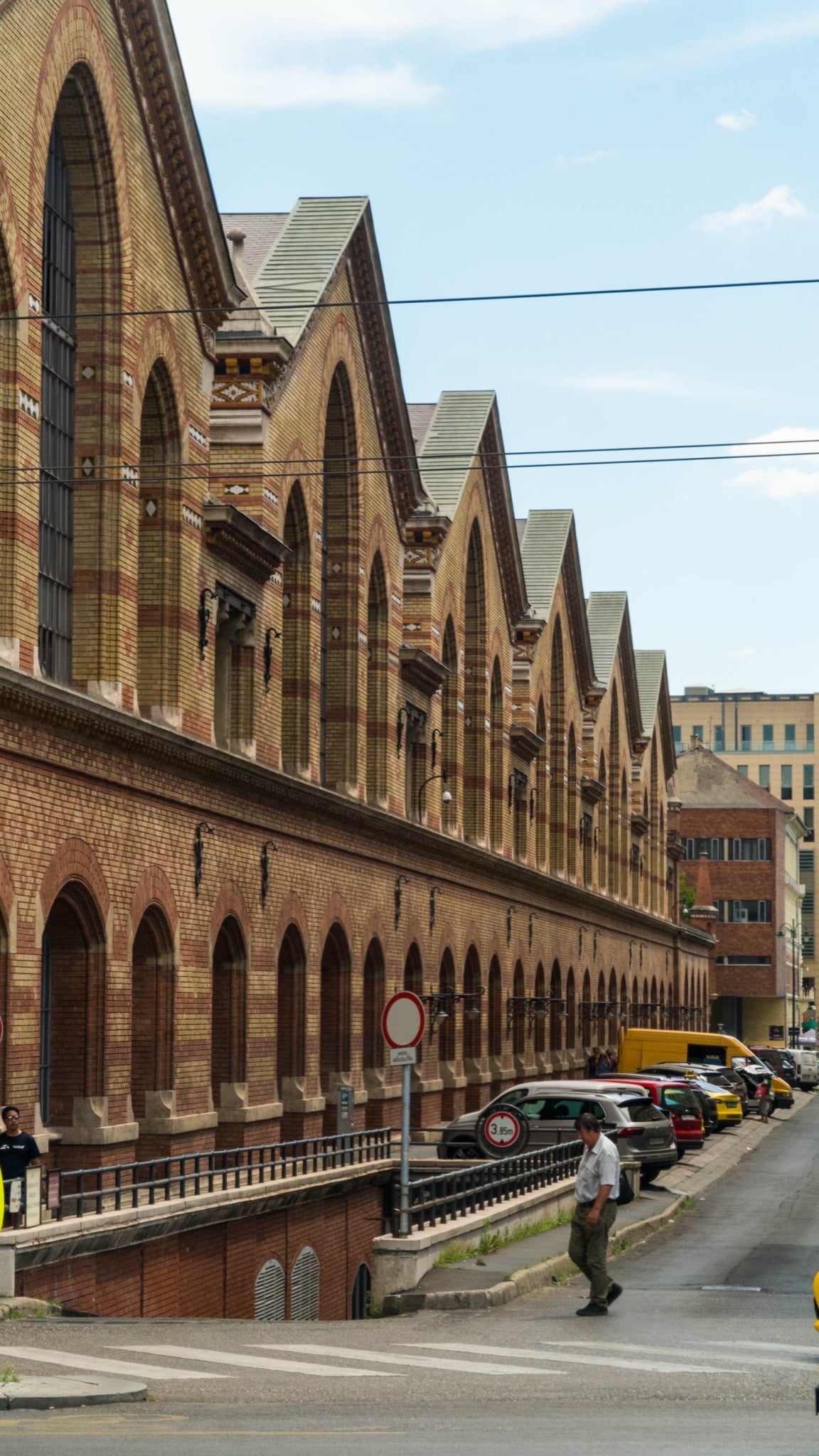 The tiled gables and brick arcade of the Great Market Hall