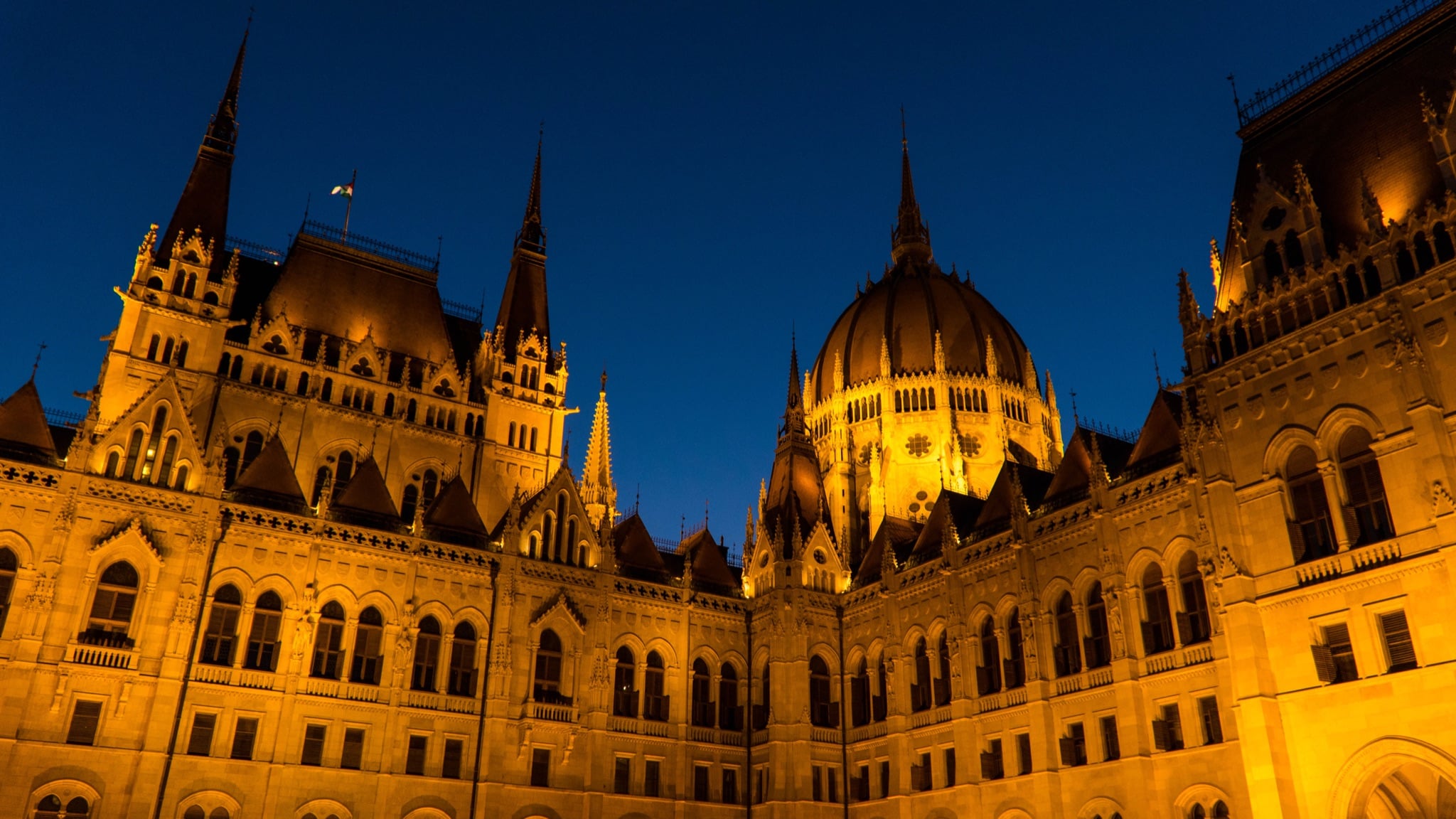 The Hungarian Parliament floodlit gold against the deep blue of dusk