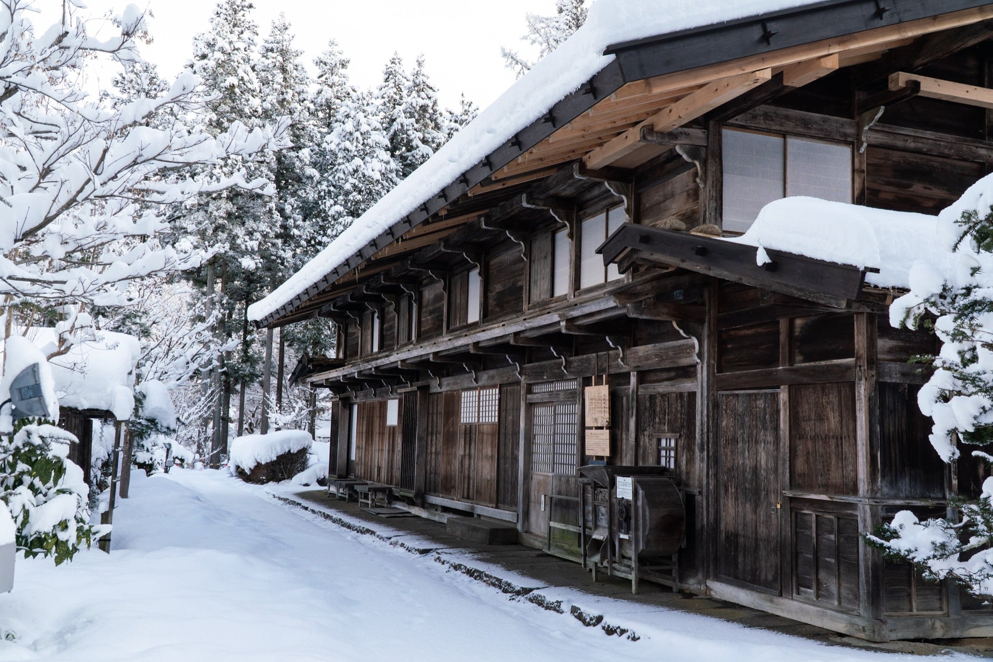 Old-town merchant houses under snow, Takayama