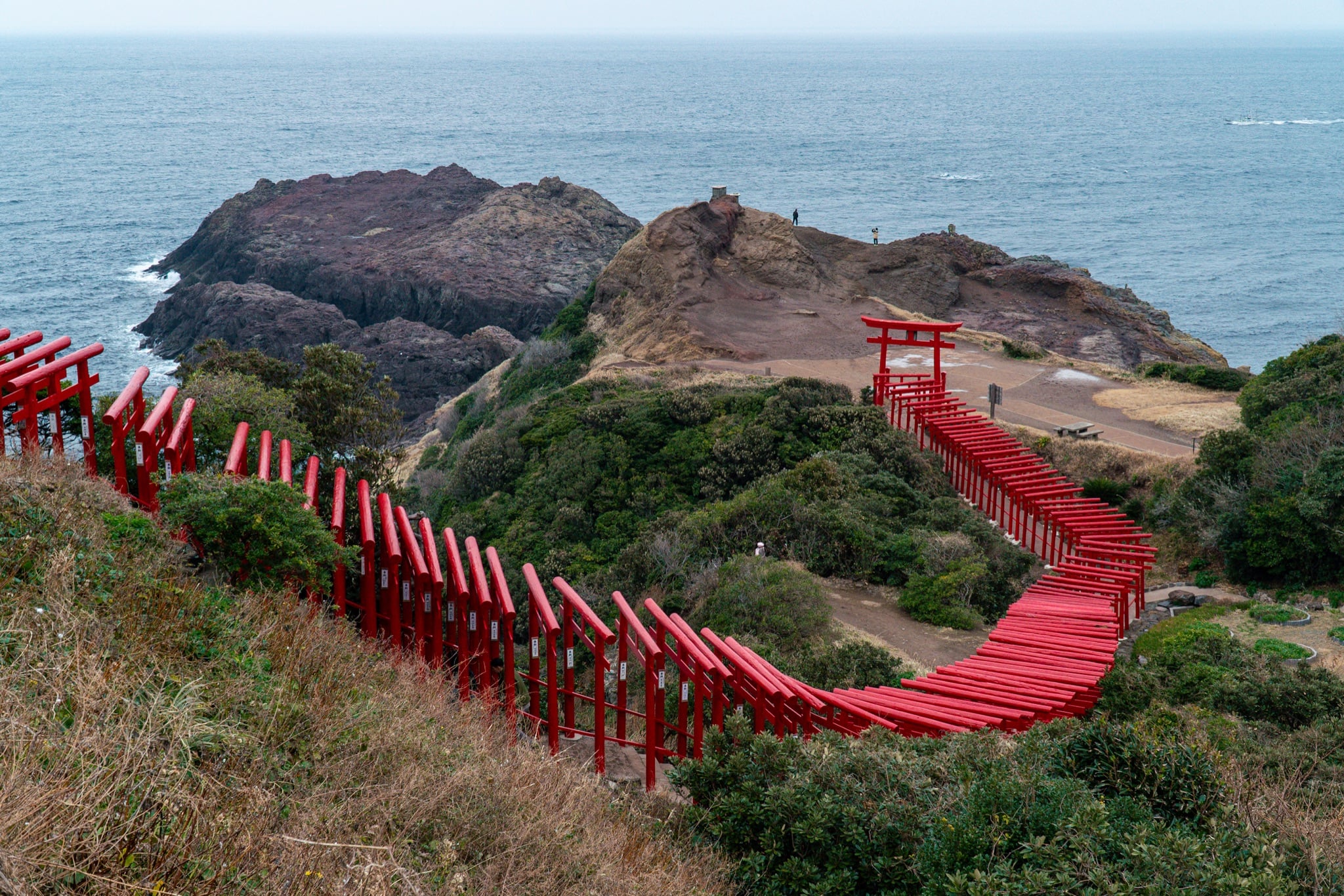 Torii gate standing at the edge of the sea