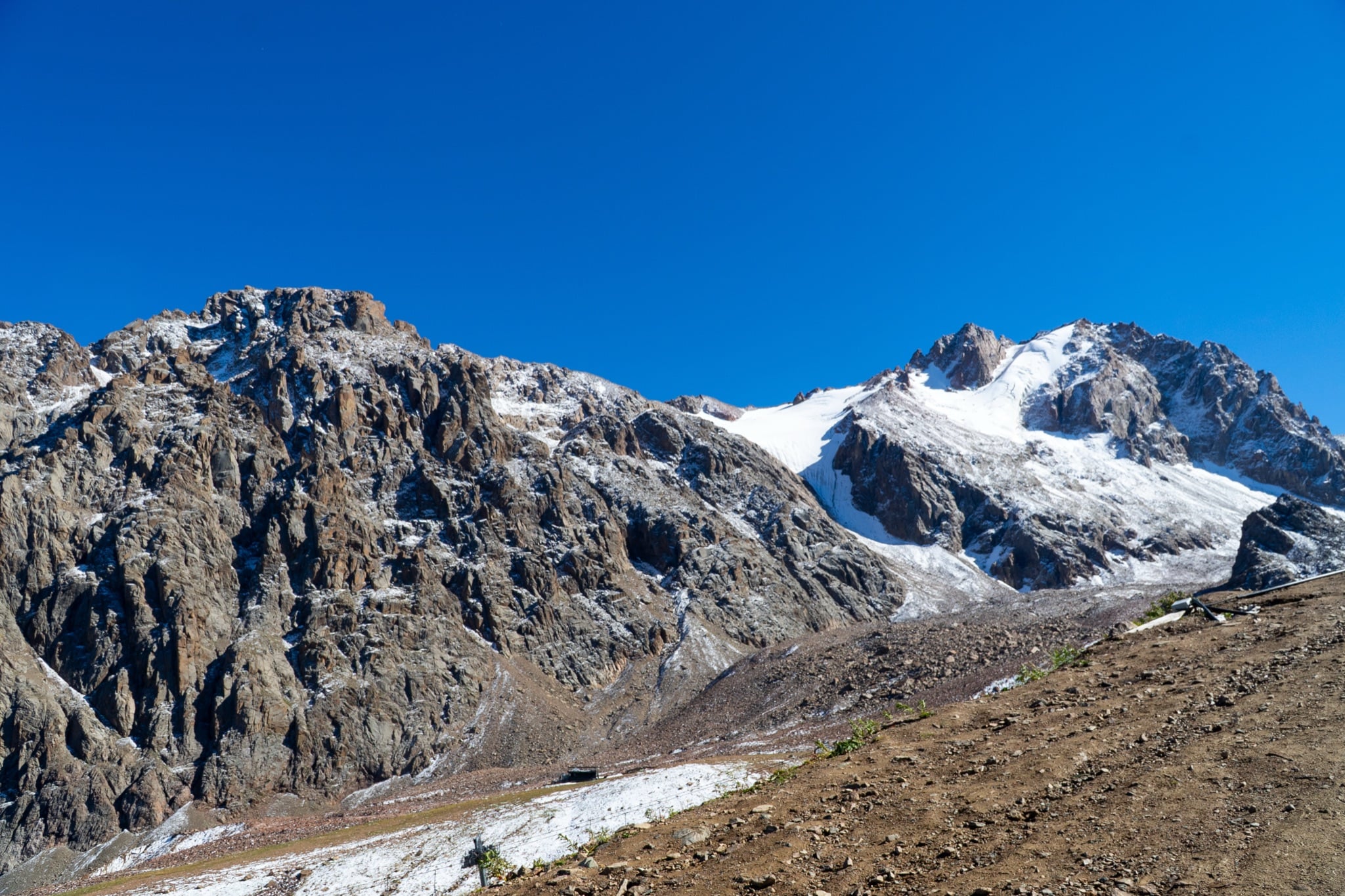 Snow-streaked peaks of the Zailiysky Alatau above Shymbulak, a glacier hanging beneath the ridge