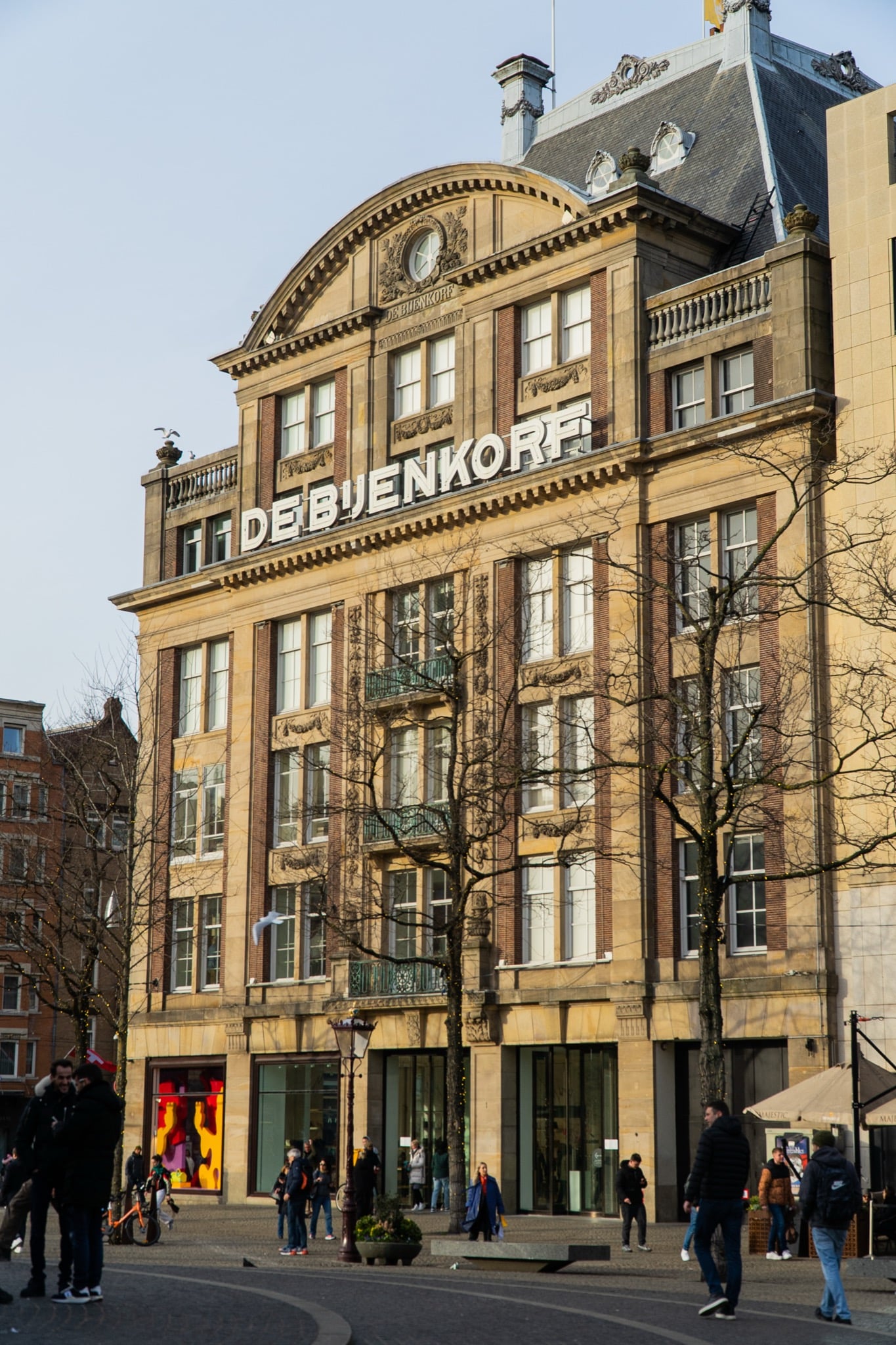 The grand De Bijenkorf department store on Dam Square catching the low winter sun