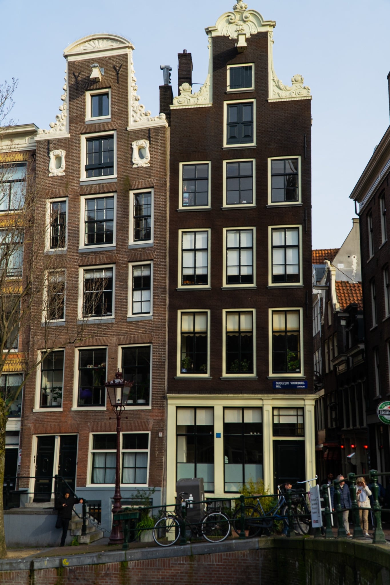 Two ornate step- and neck-gabled houses on the corner of Oudezijds Voorburgwal