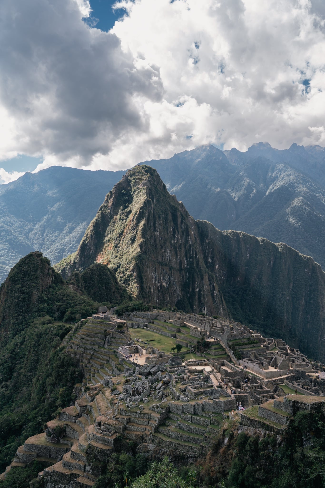 The citadel and Huayna Picchu beneath a dramatic cloud bank