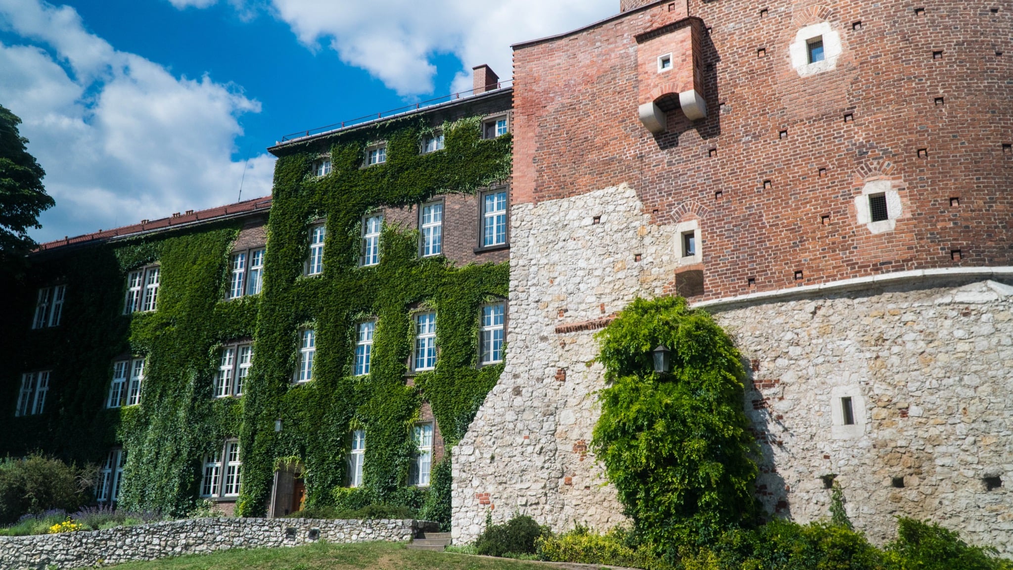 Ivy-clad brick ramparts of Wawel Castle on the hill above Kraków