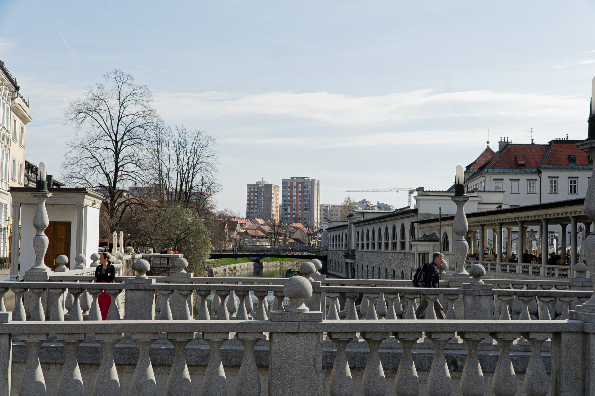 The balustraded riverside embankment and old-town rooftops along the Ljubljanica, Ljubljana