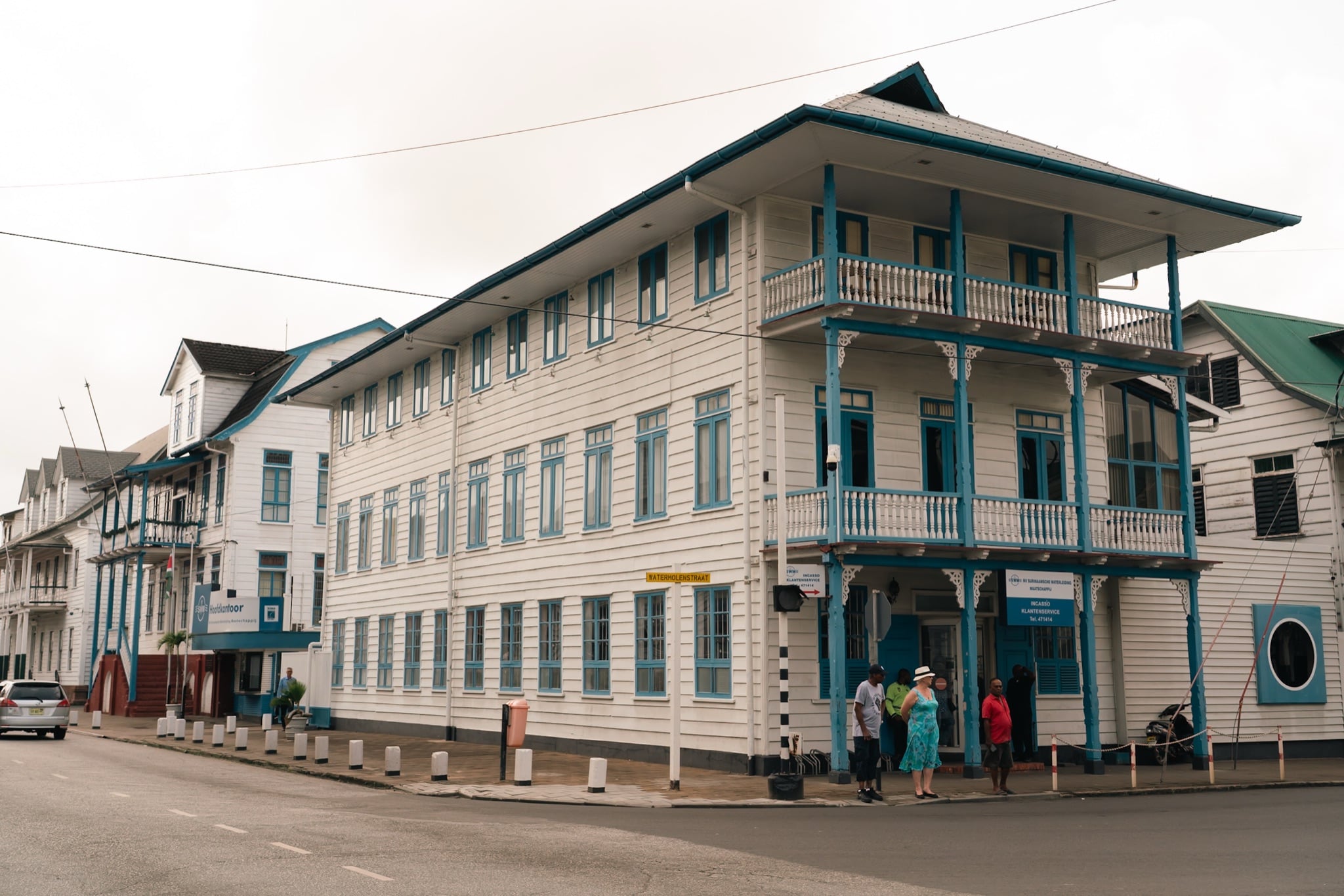 Low colonial buildings lining a Paramaribo avenue