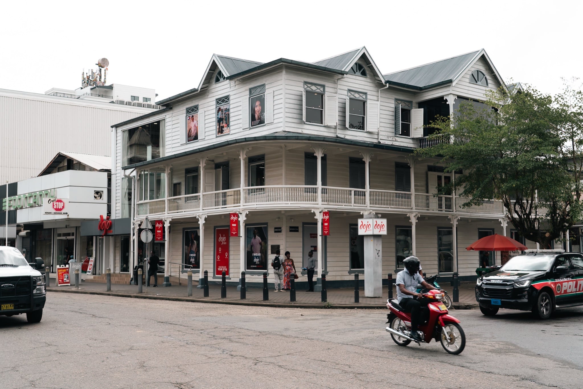 Traffic and shopfronts in downtown Paramaribo