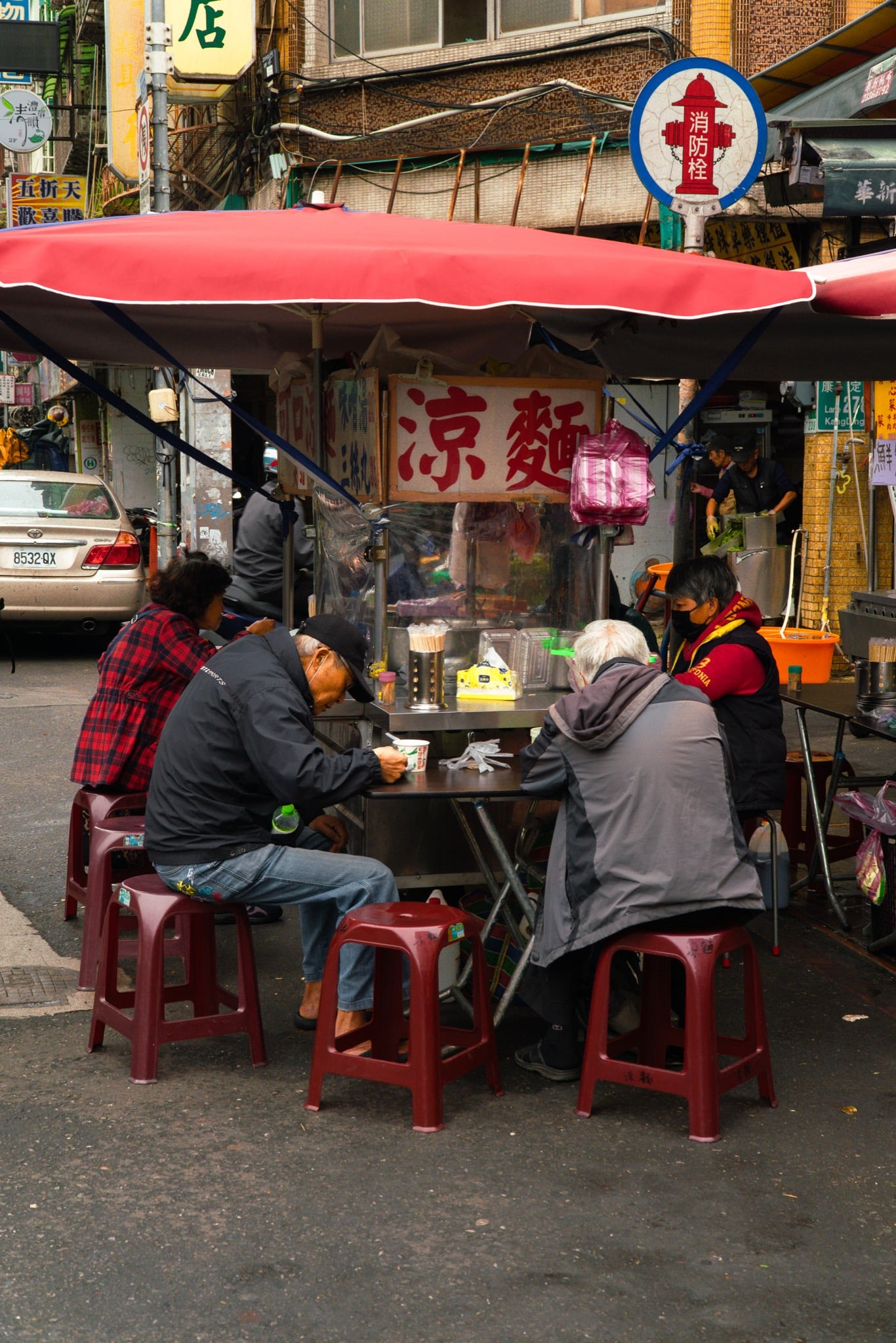Stalls and signboards crowding Guangzhou Street, Taipei
