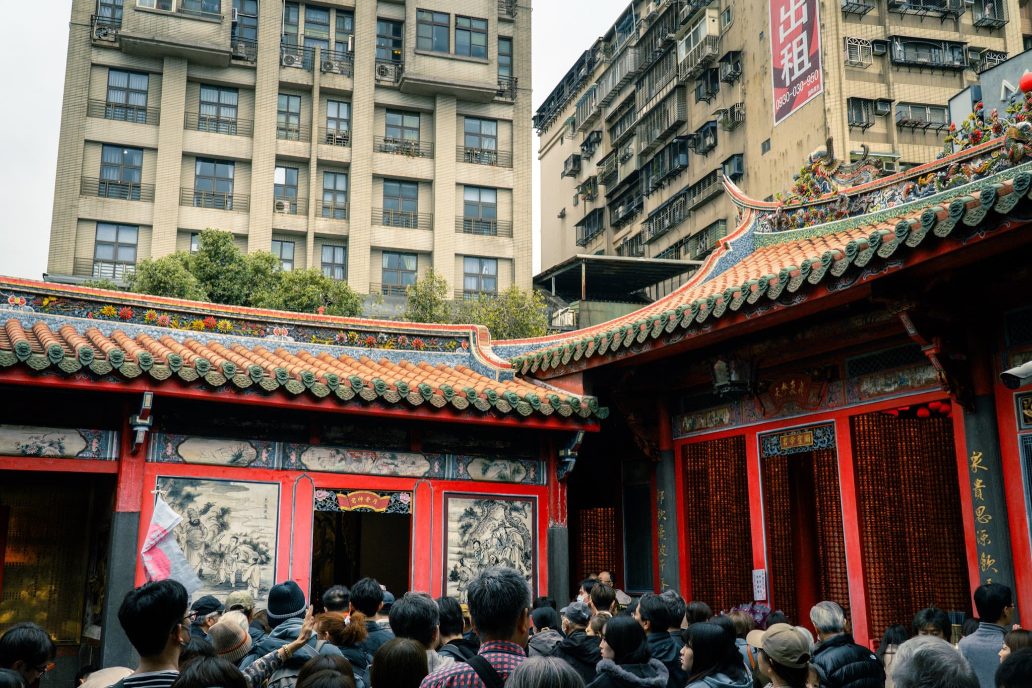 Worshippers gathered in the courtyard of Lungshan Temple, Taipei