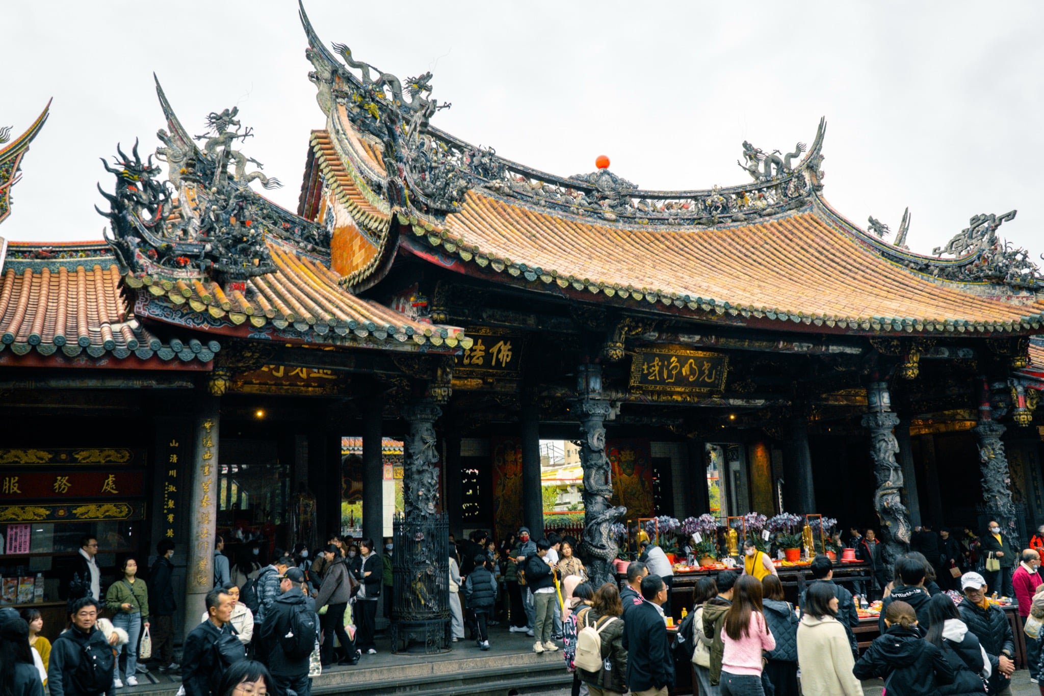 Carved dragon columns at the entrance to Lungshan Temple, Taipei