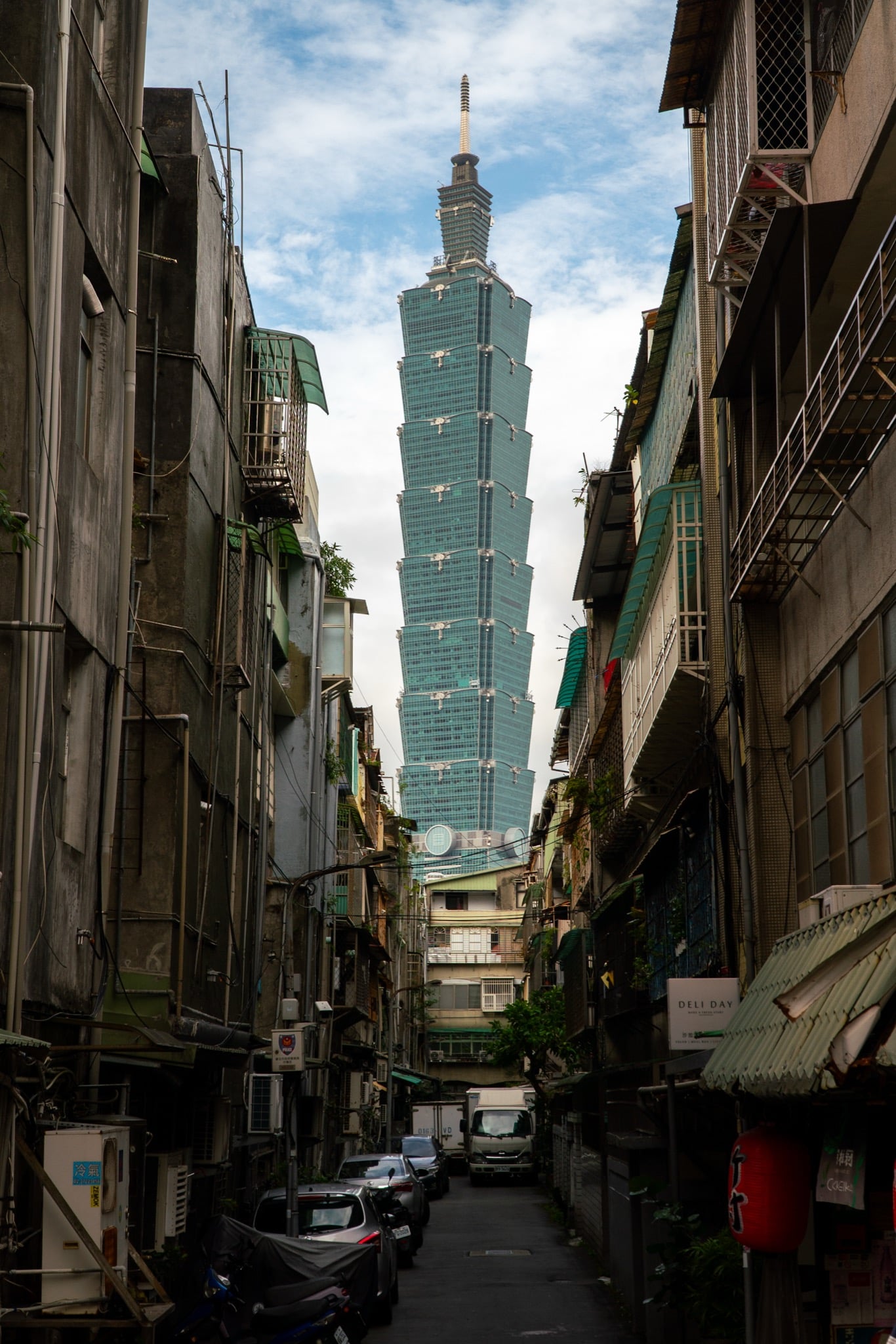 The tapered tiers of Taipei 101 climbing into the clouds