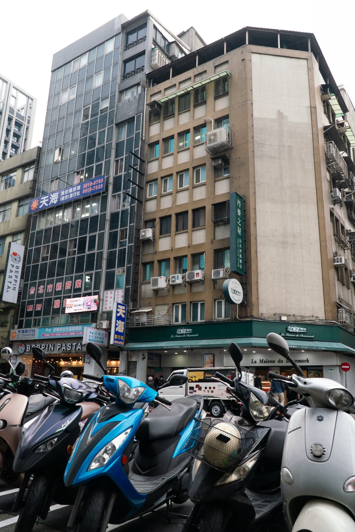 Mopeds parked along a Ximen side street, Taipei