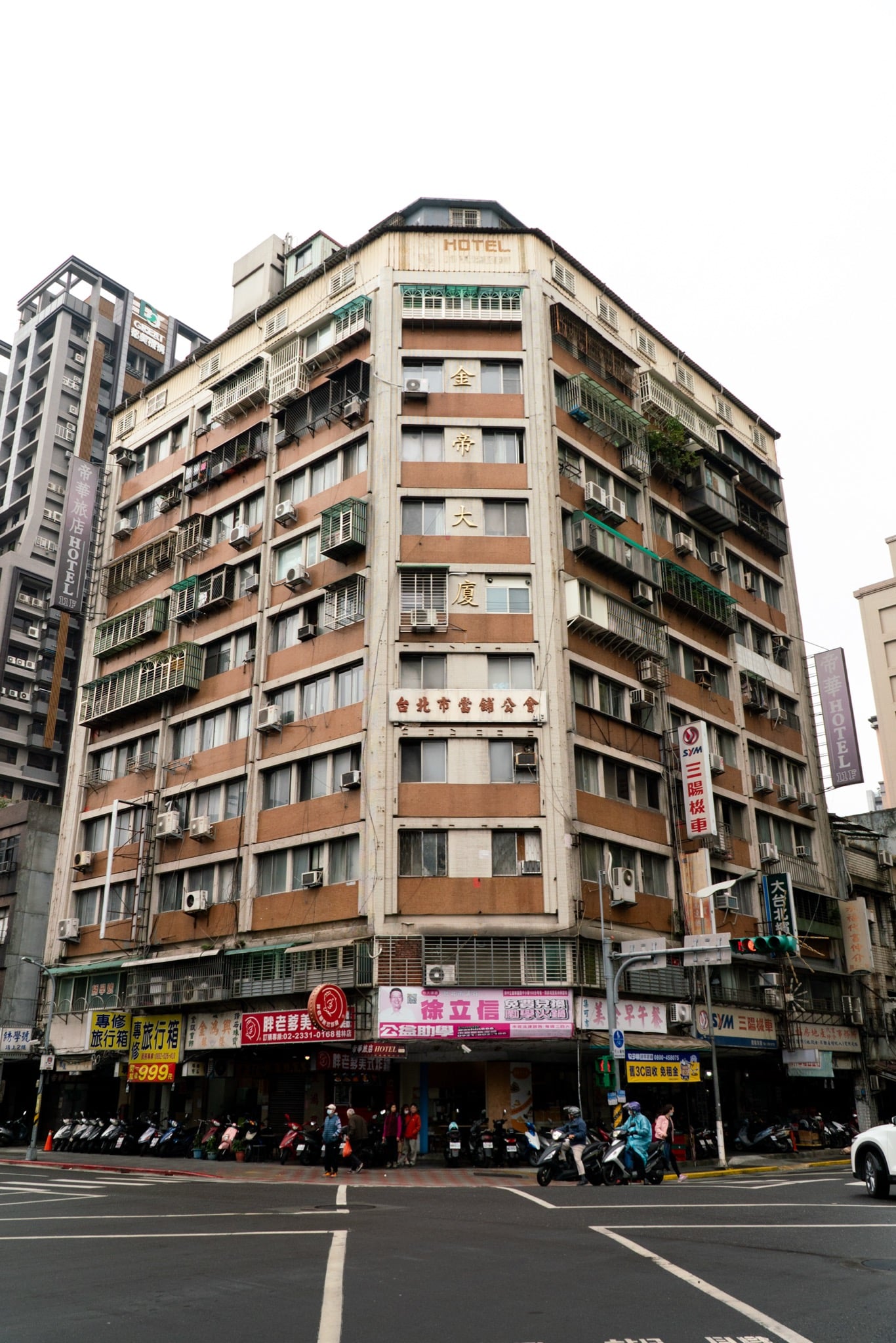 Neon storefronts lining a Ximending lane, Taipei