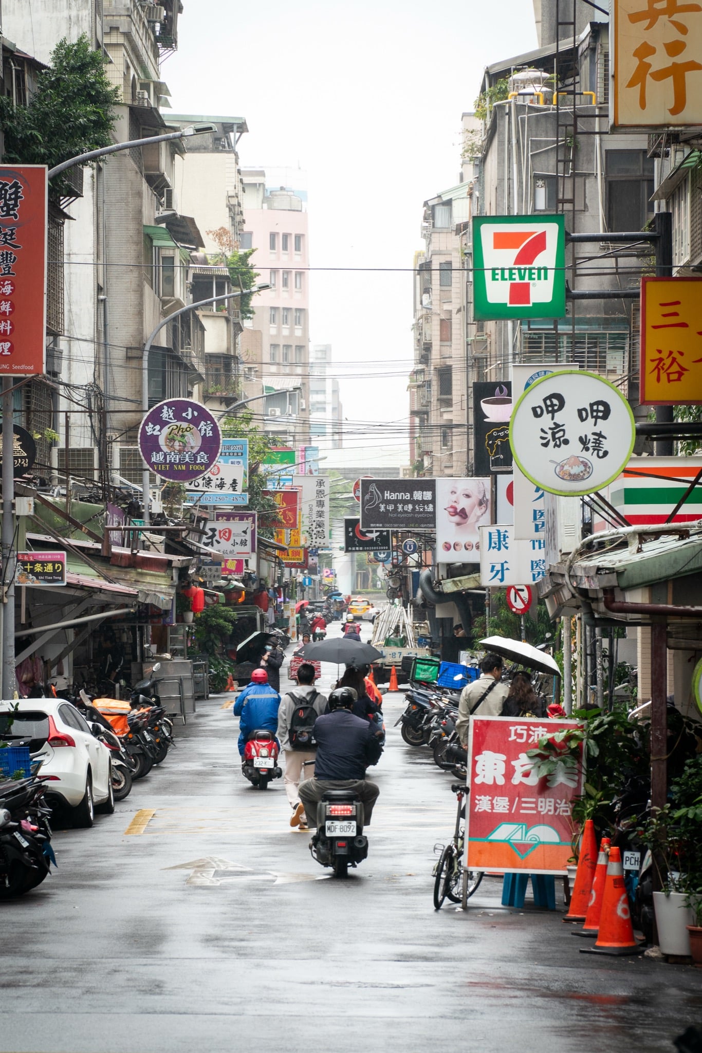 Pedestrians threading the shopping streets of Ximen, Taipei