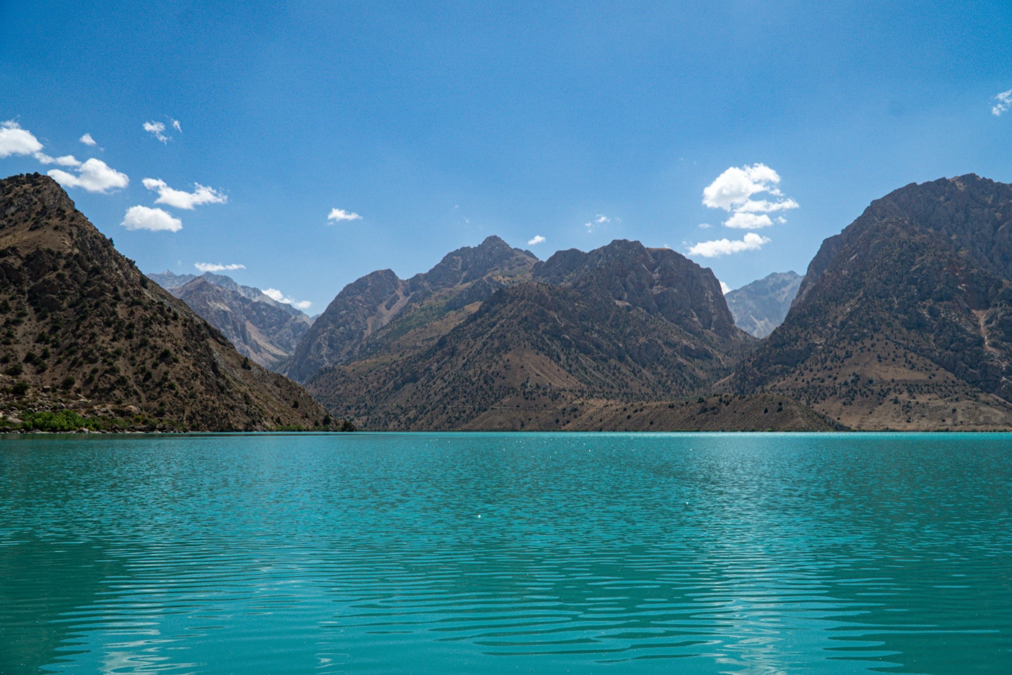 Iskanderkul lake ringed by the Fann Mountains