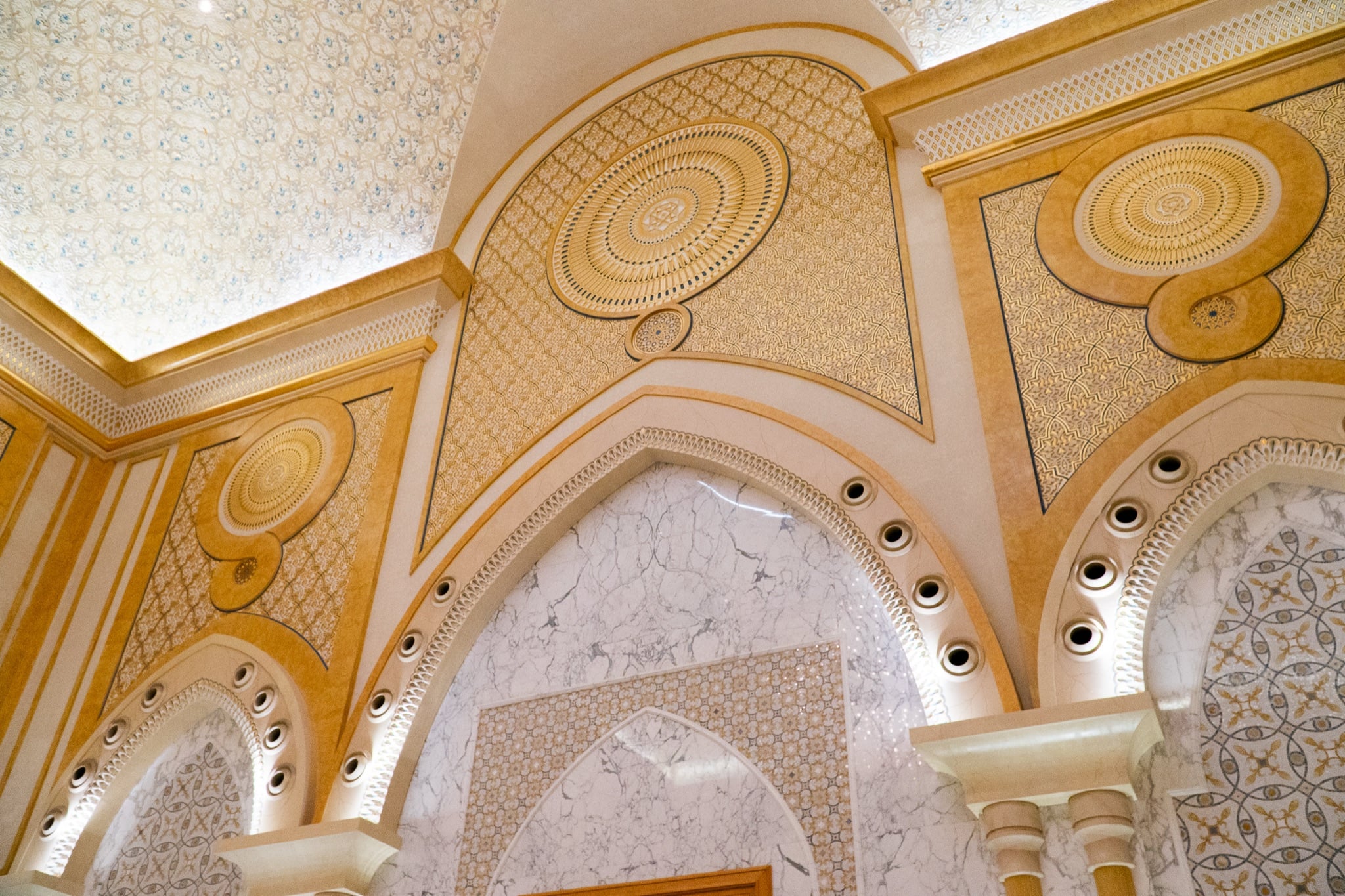 A sunlit marble gallery within Qasr Al Watan