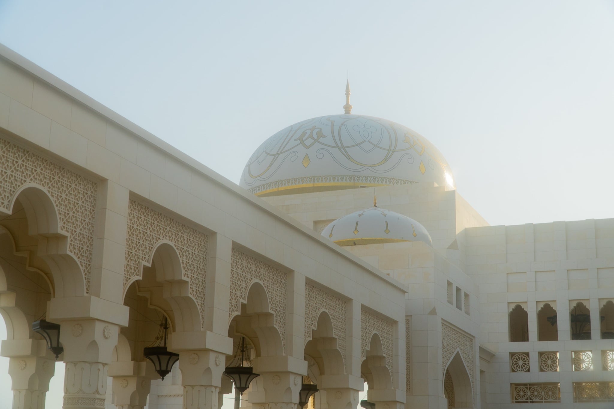 Carved white-and-gold walls of Qasr Al Watan