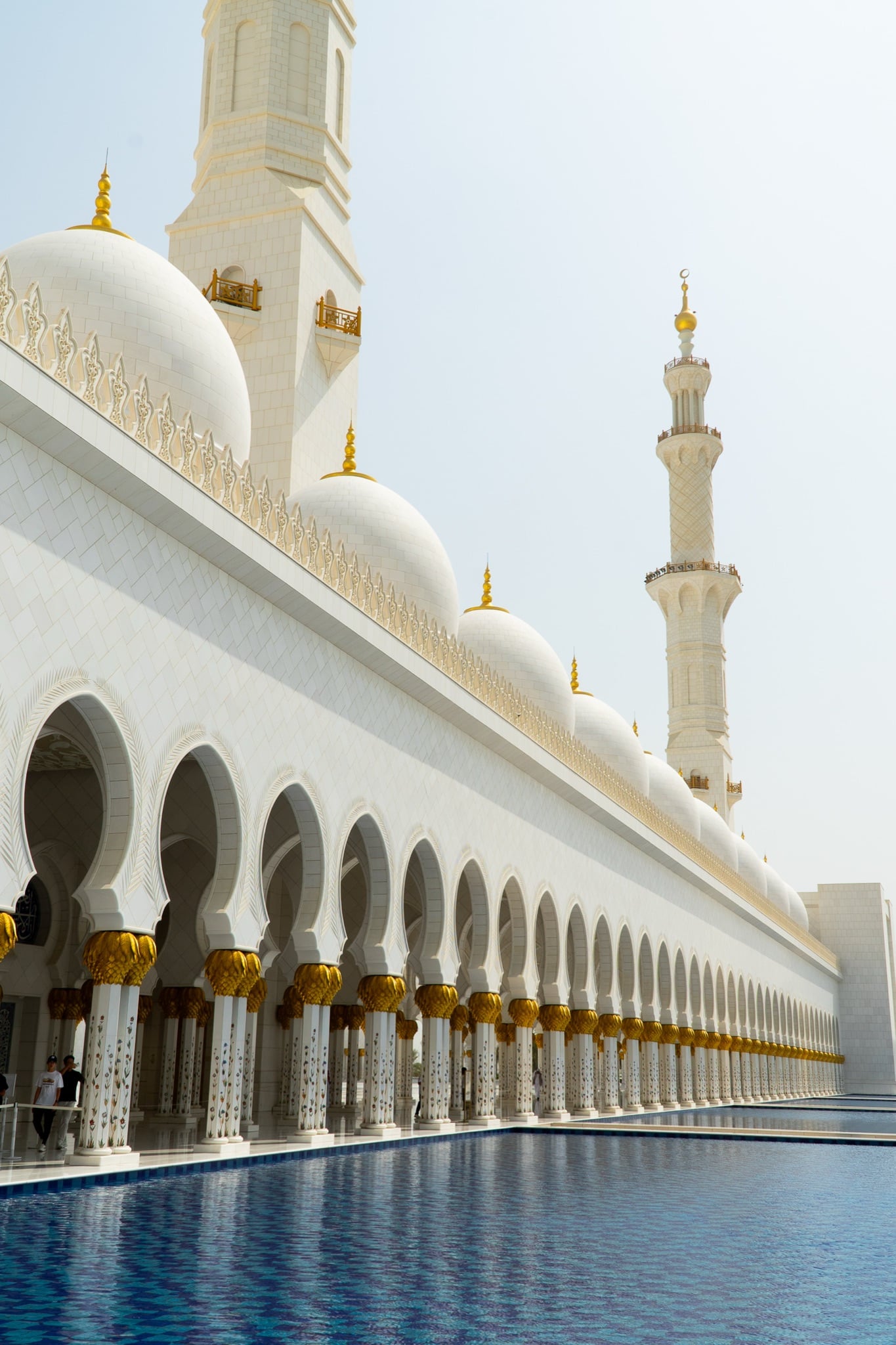 A shaded corner of the mosque's marble arcade