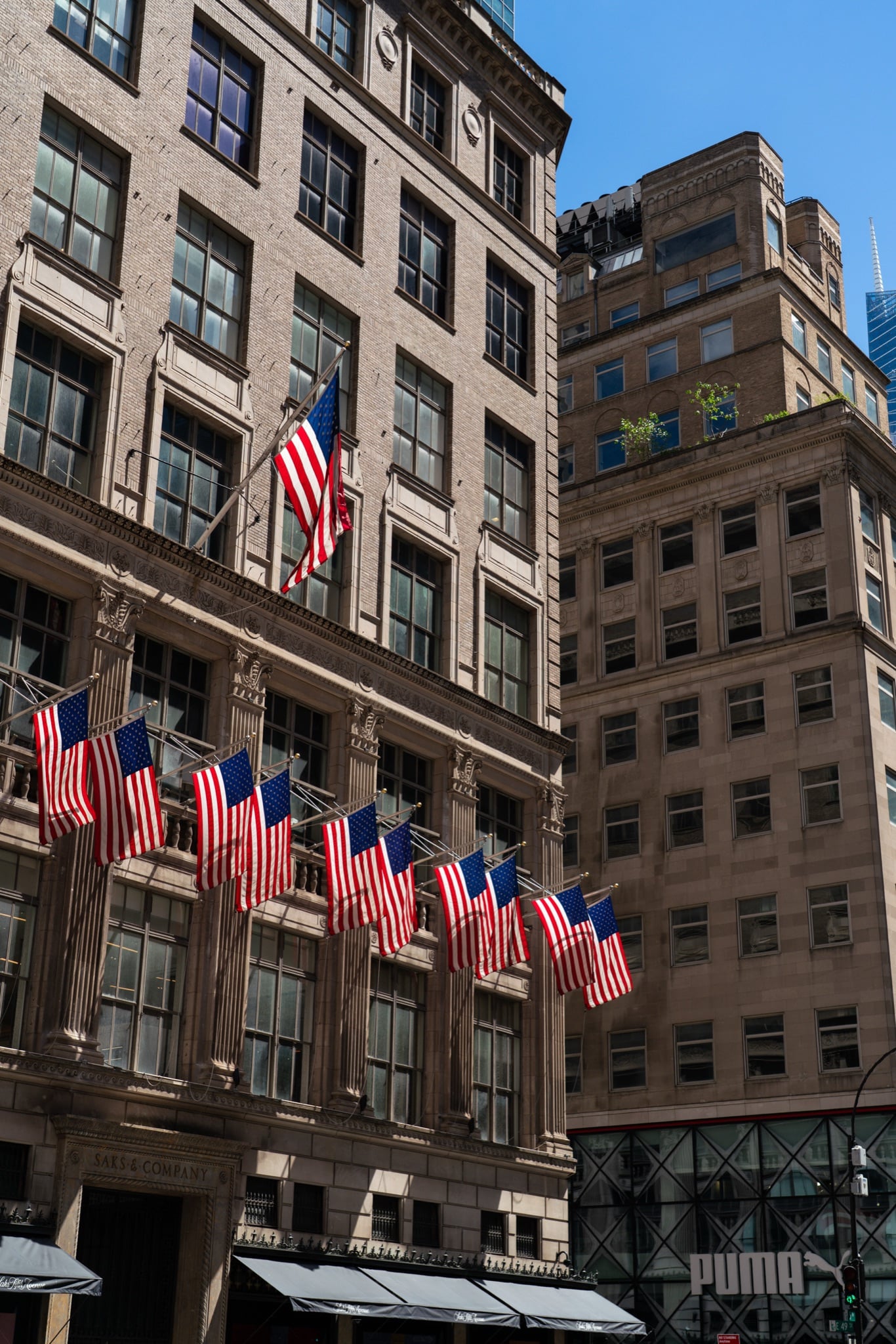 American flags hung across a Manhattan facade
