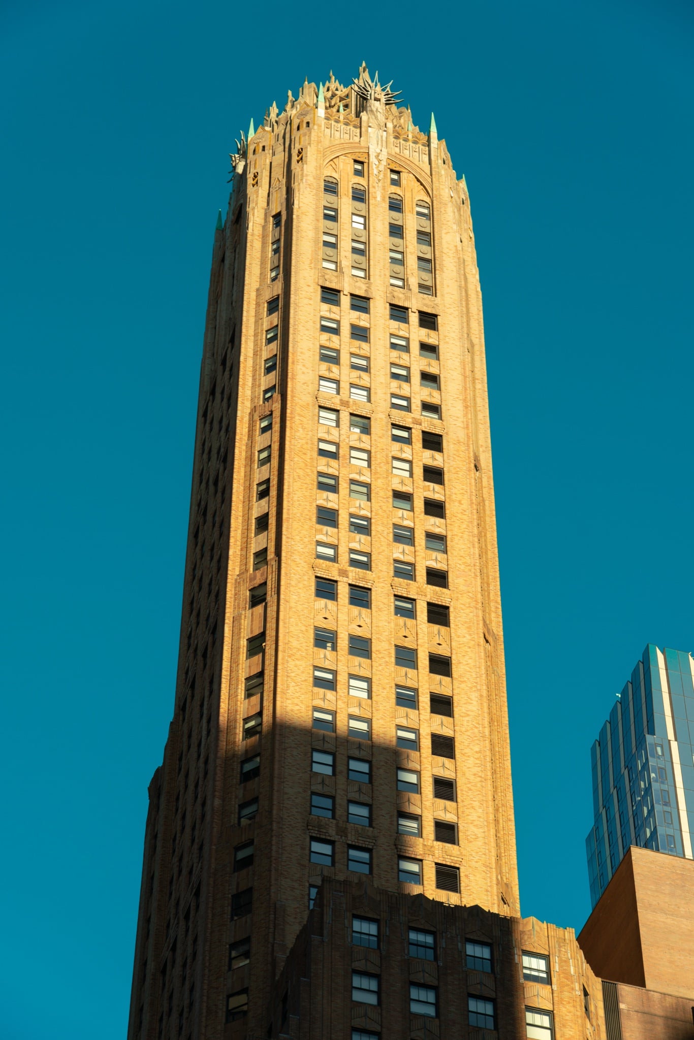 A Manhattan tower seen from the street below