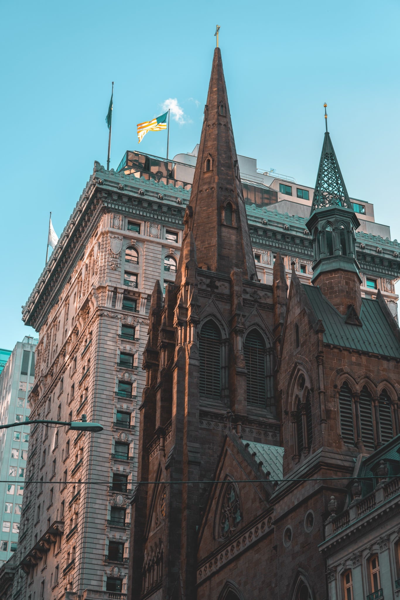 A historic church spire among the towers
